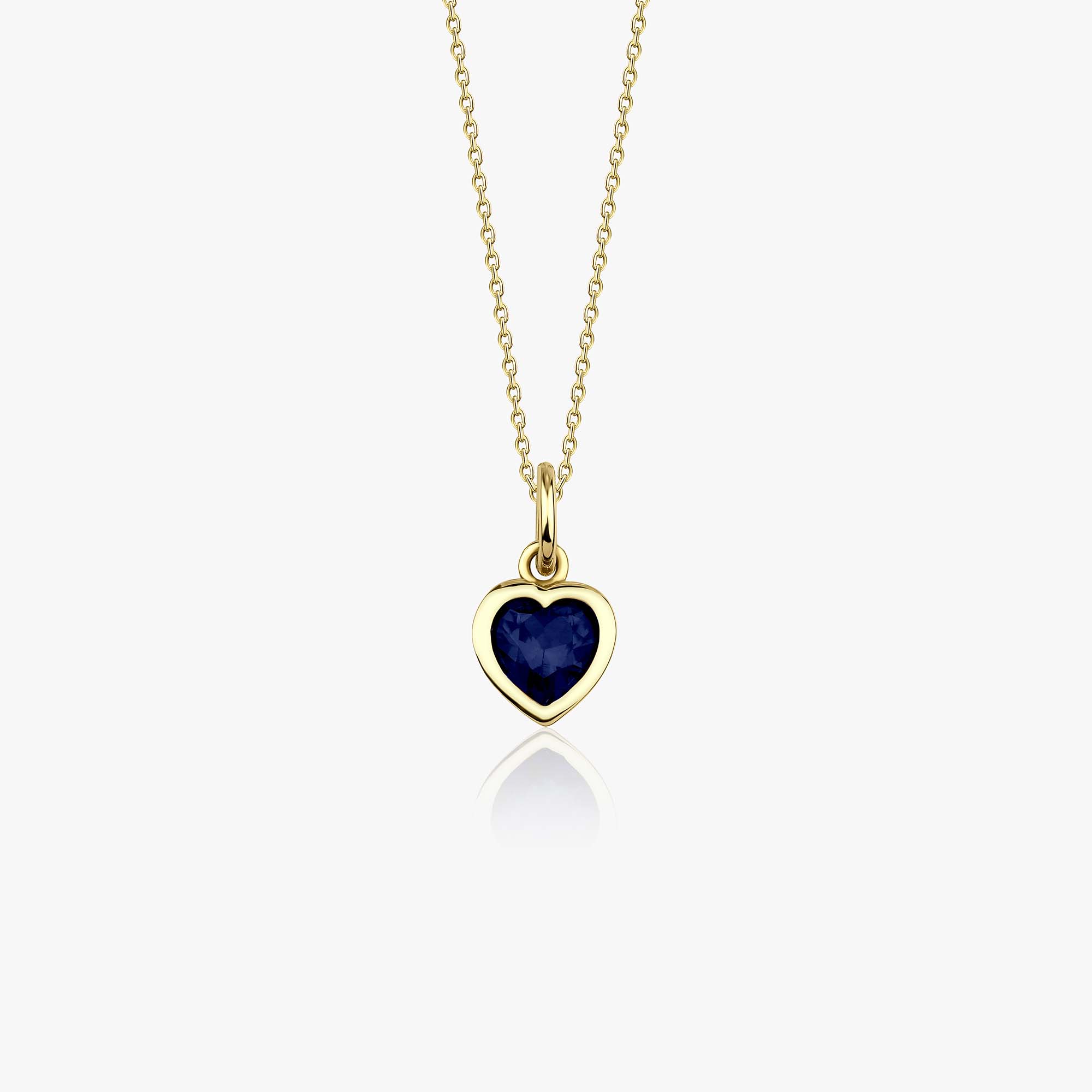 A 14k yellow gold necklace with a heart-shaped pendant featuring a blue gemstone on a white background