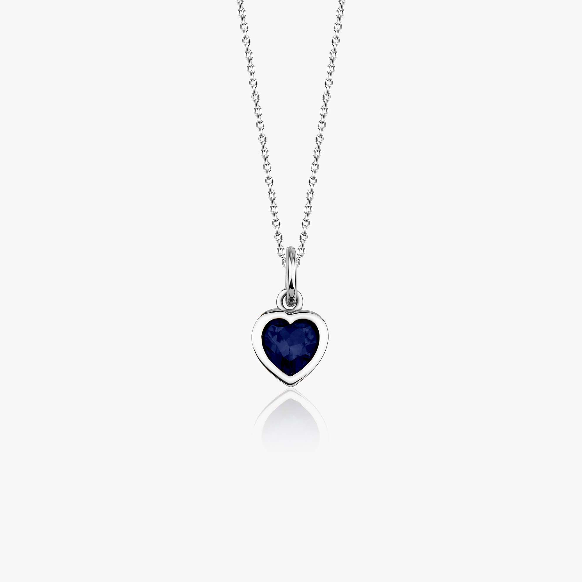 A 14k white gold necklace with a heart-shaped pendant featuring a blue gemstone on a white background