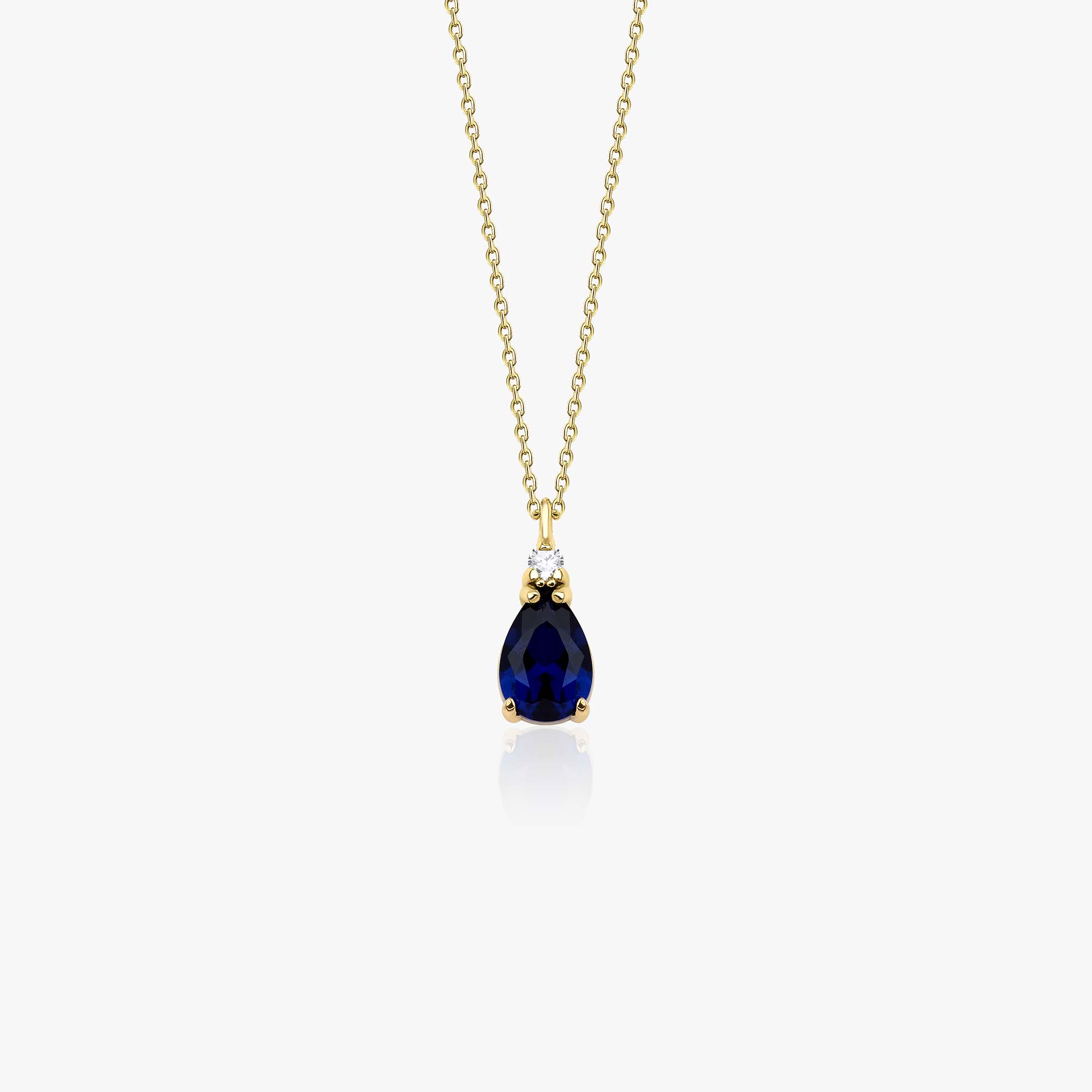 A 14k yellow gold dark blue drop necklace shown on a white background
