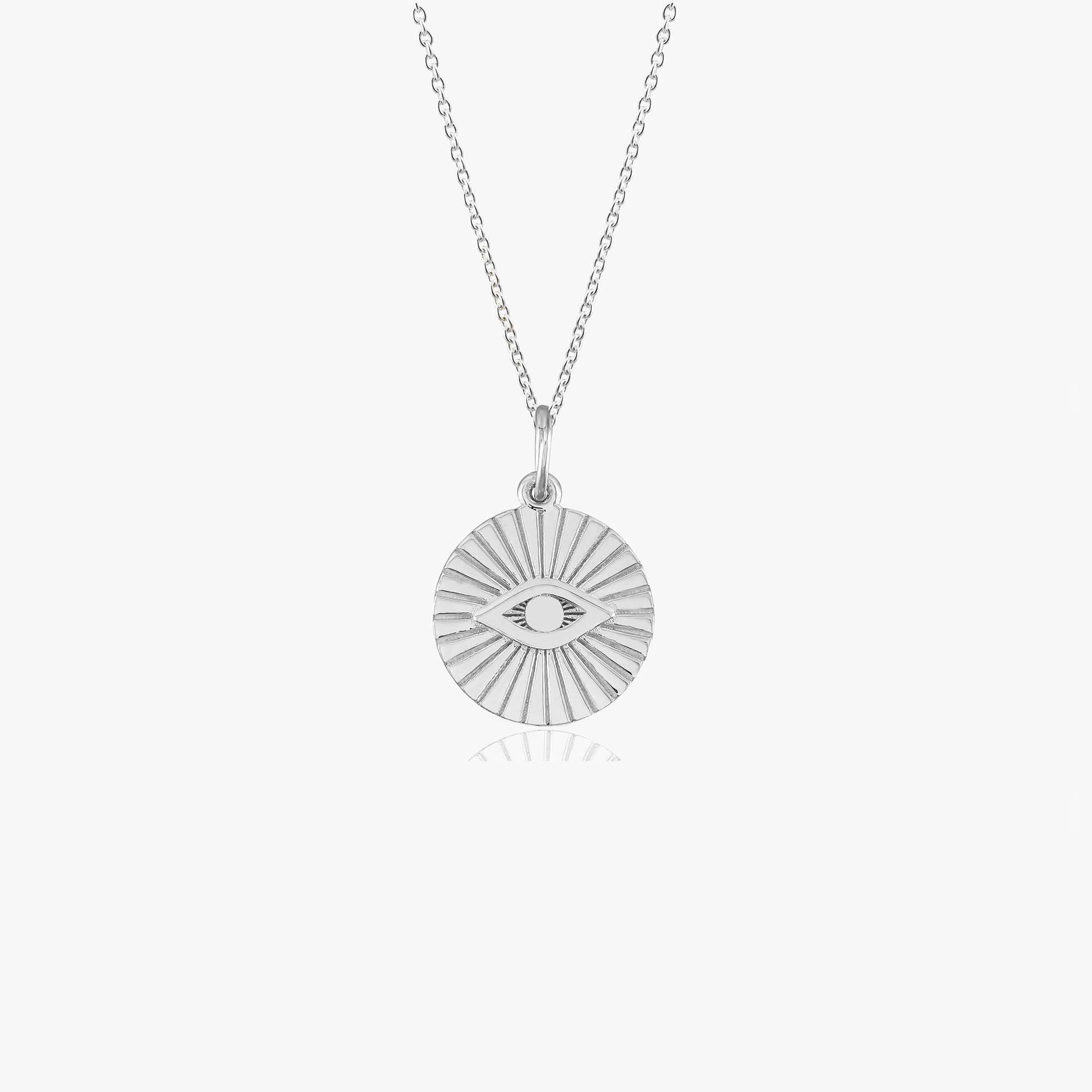 A 14k white gold evil eye coin pendant necklace shown on a white background