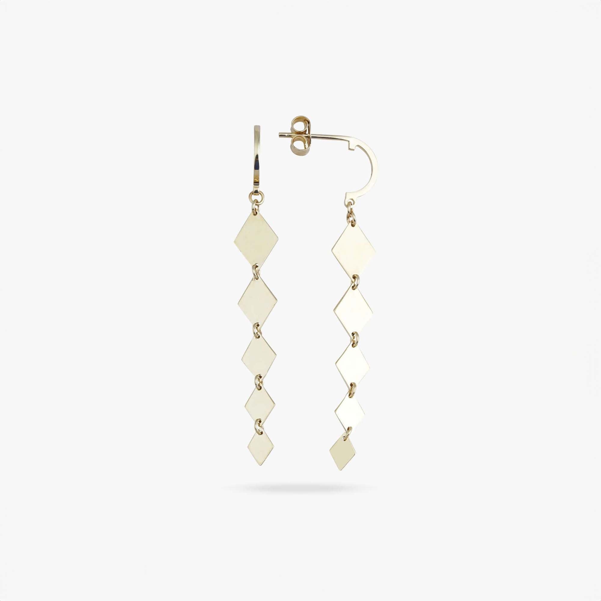 Pair of gold earrings with diamond-shaped pendants on a white background