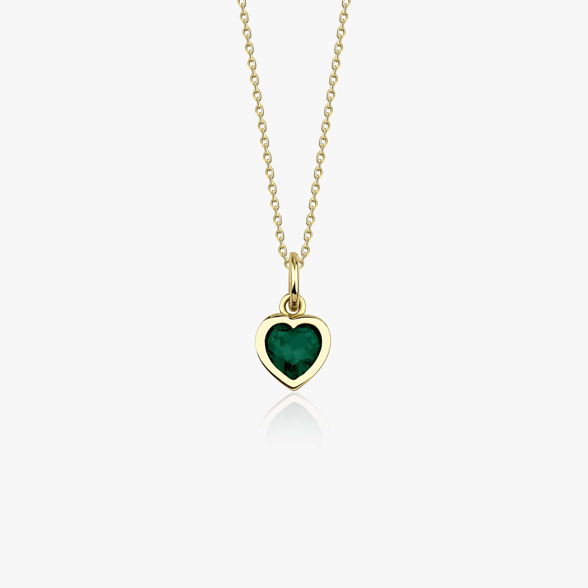 A 14k yellow gold heart necklace with a green heart cut cubic zirconia center shown on a white background.