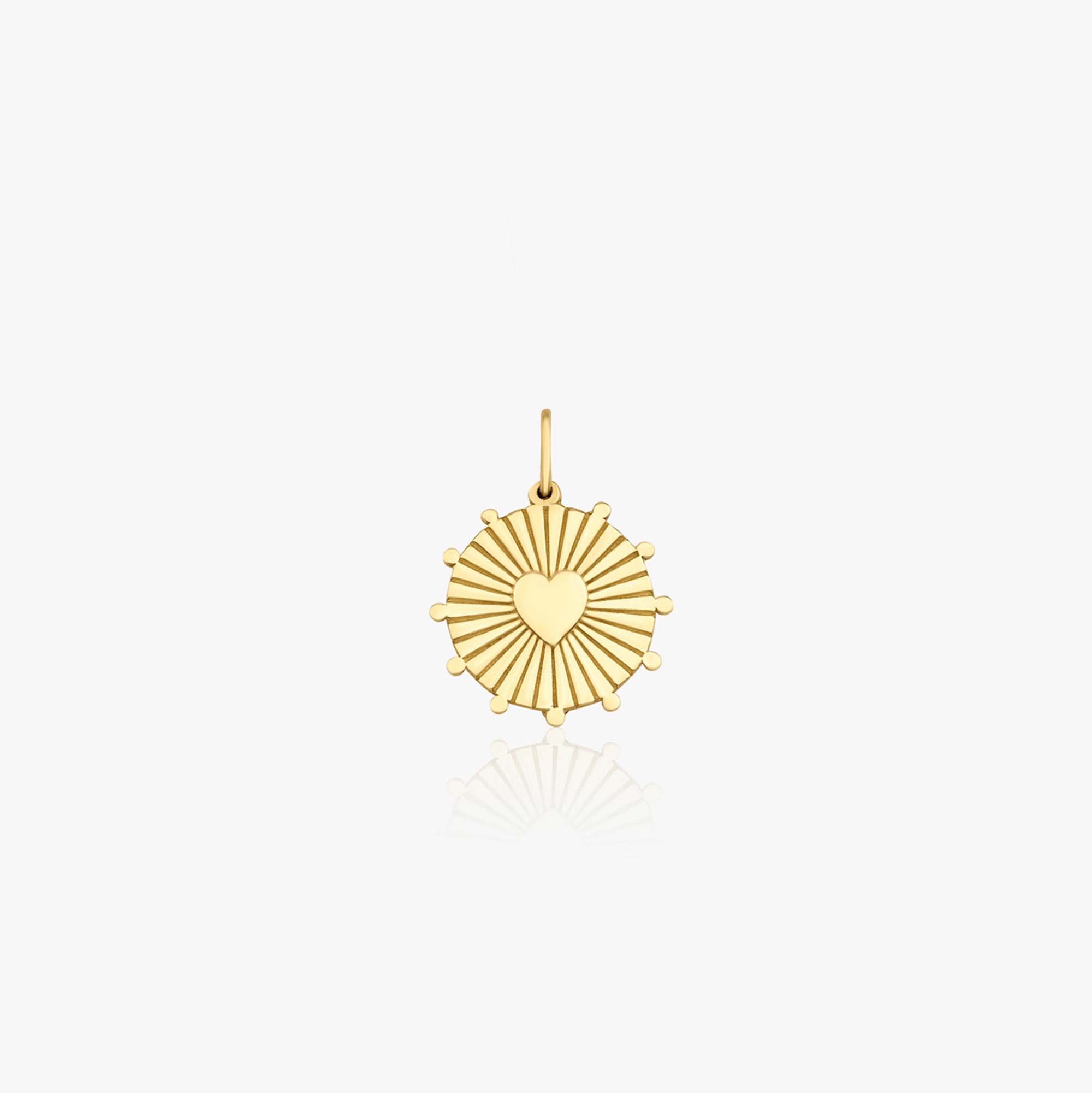 A 14k yellow gold heartburst coin pendant shown on a white background.