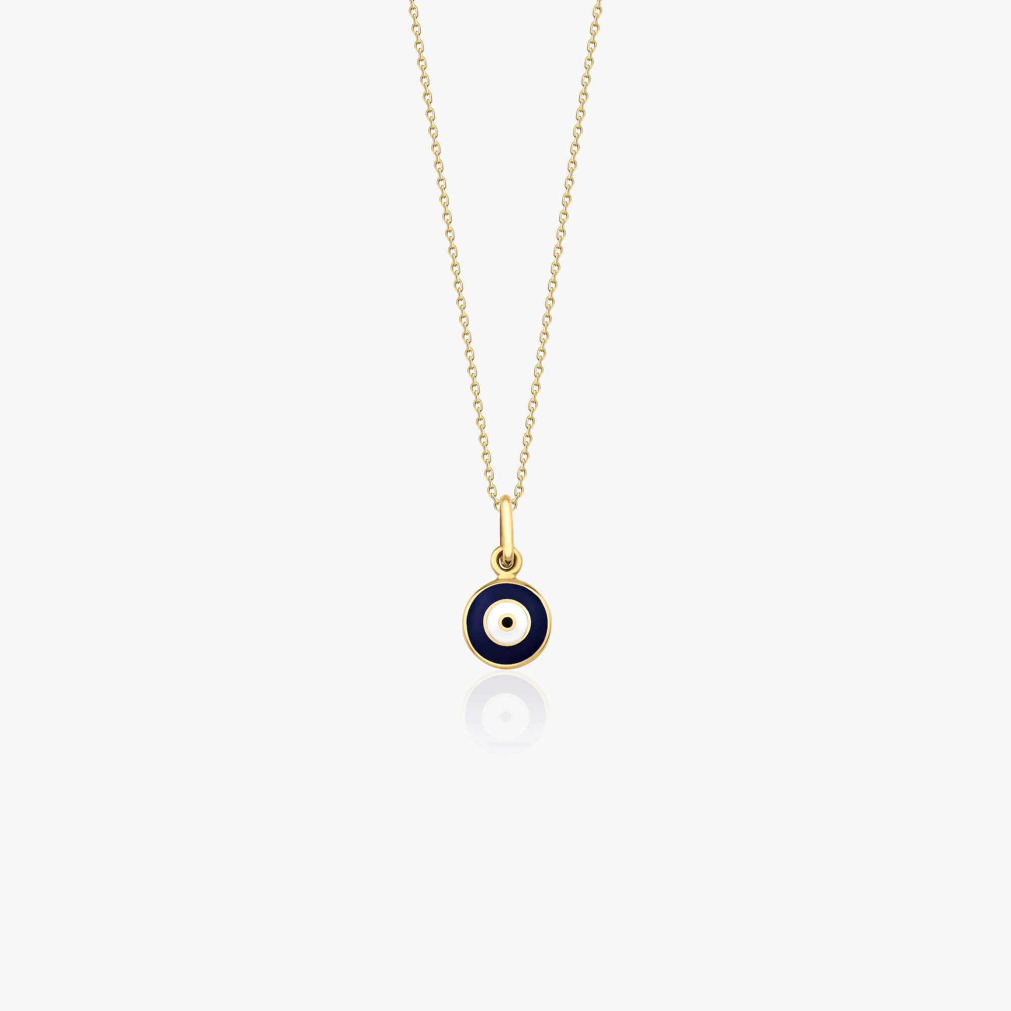 A 14k yellow gold evil eye necklace with a tiny navy blue evil eye pendant shown on a white background.