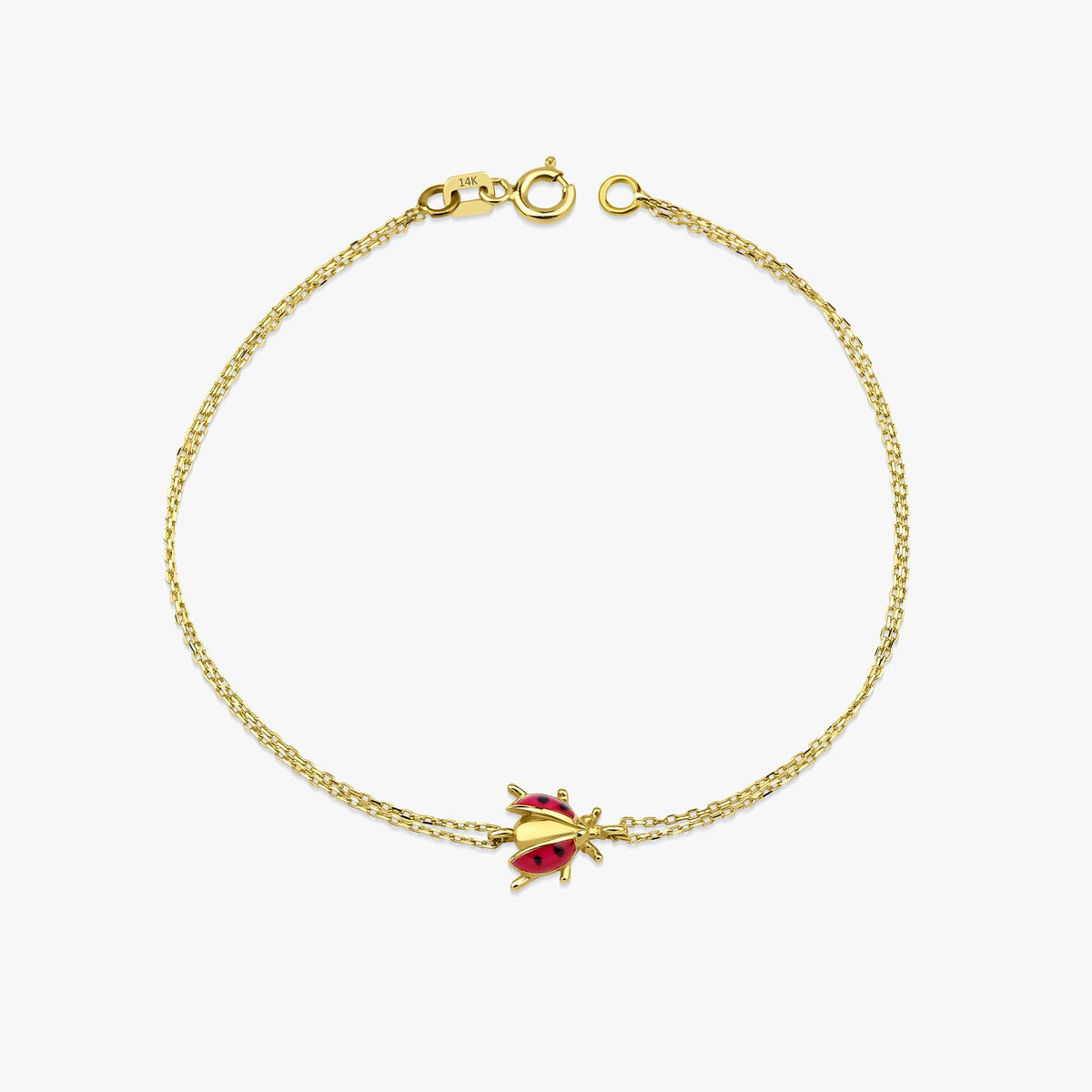 A 14K gold chain bracelet with a gold Kt stamp, featuring a dainty ladybug design in the center.