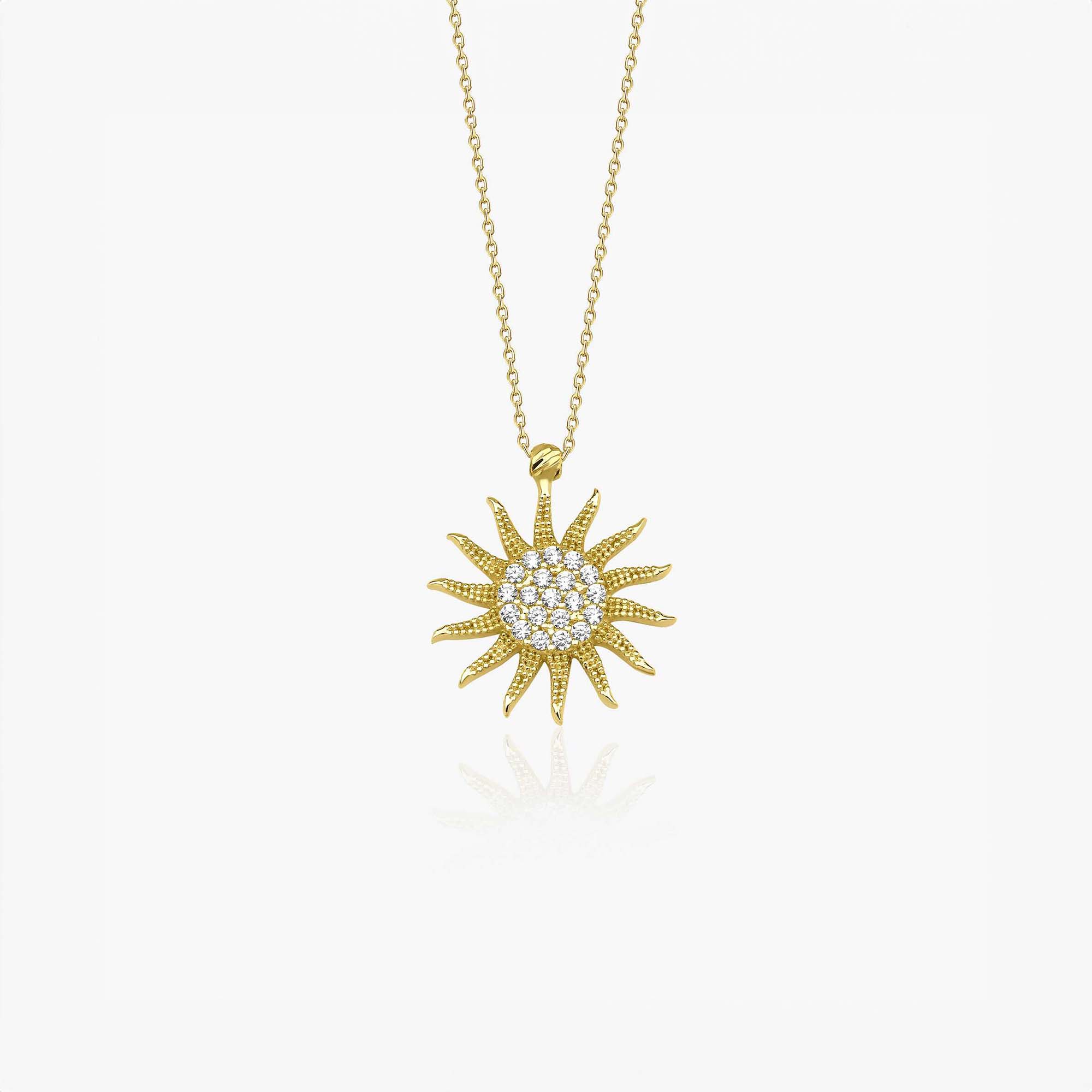 14K yellow gold sun-shaped pendant necklace on a white background