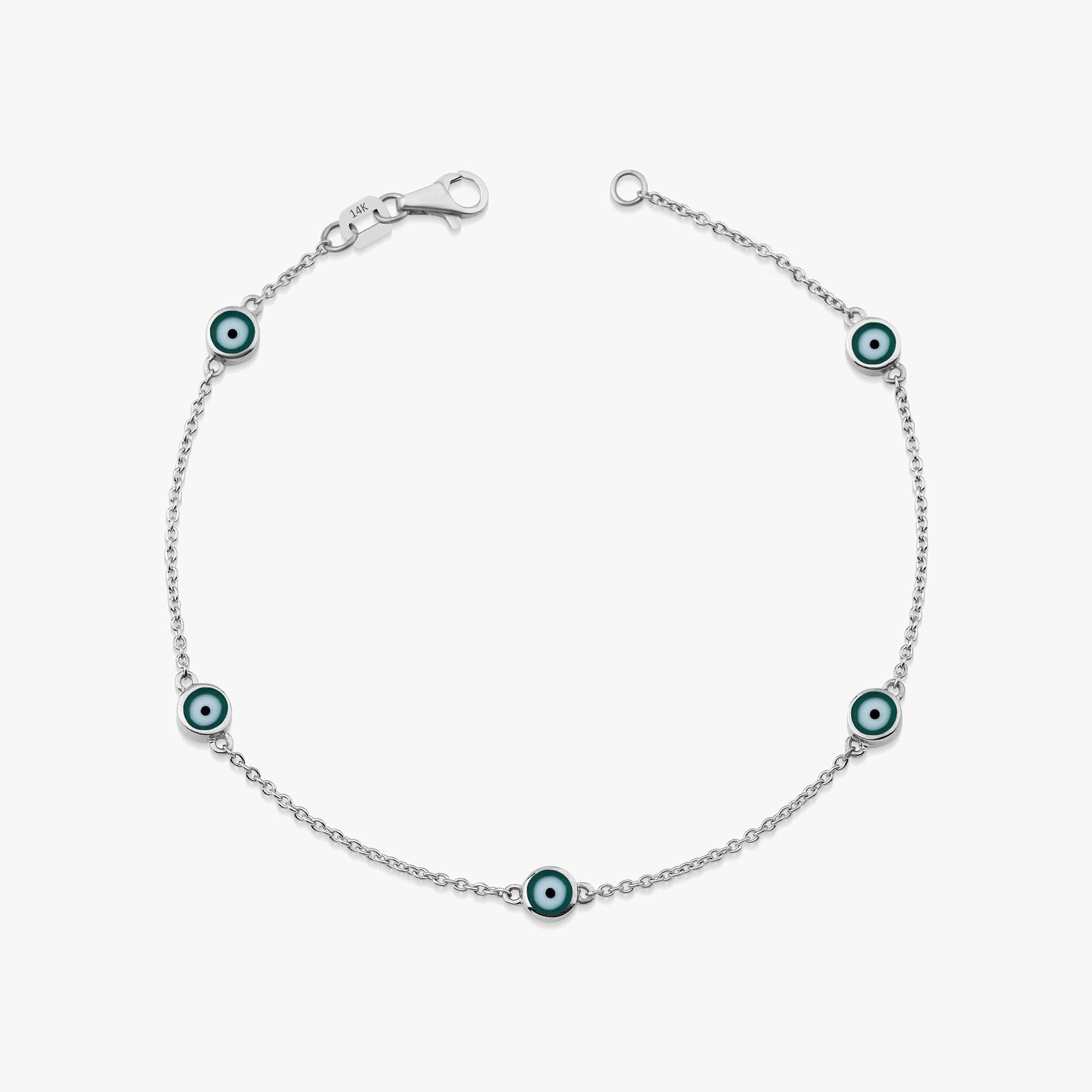 14k white gold evil eye bracelet with 5 green evil eyes shown on a white background