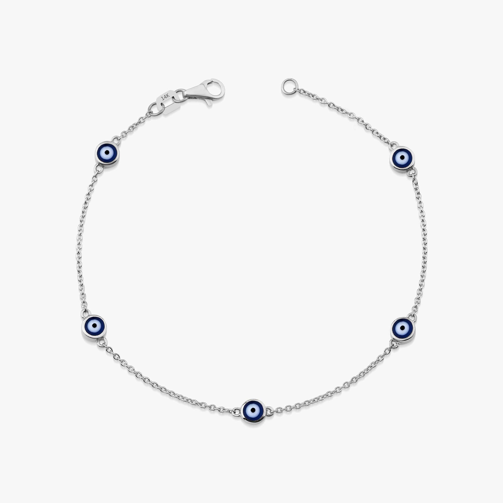 14k white gold navy blue evil eye bracelet with 5 evil eyes shown on a white background