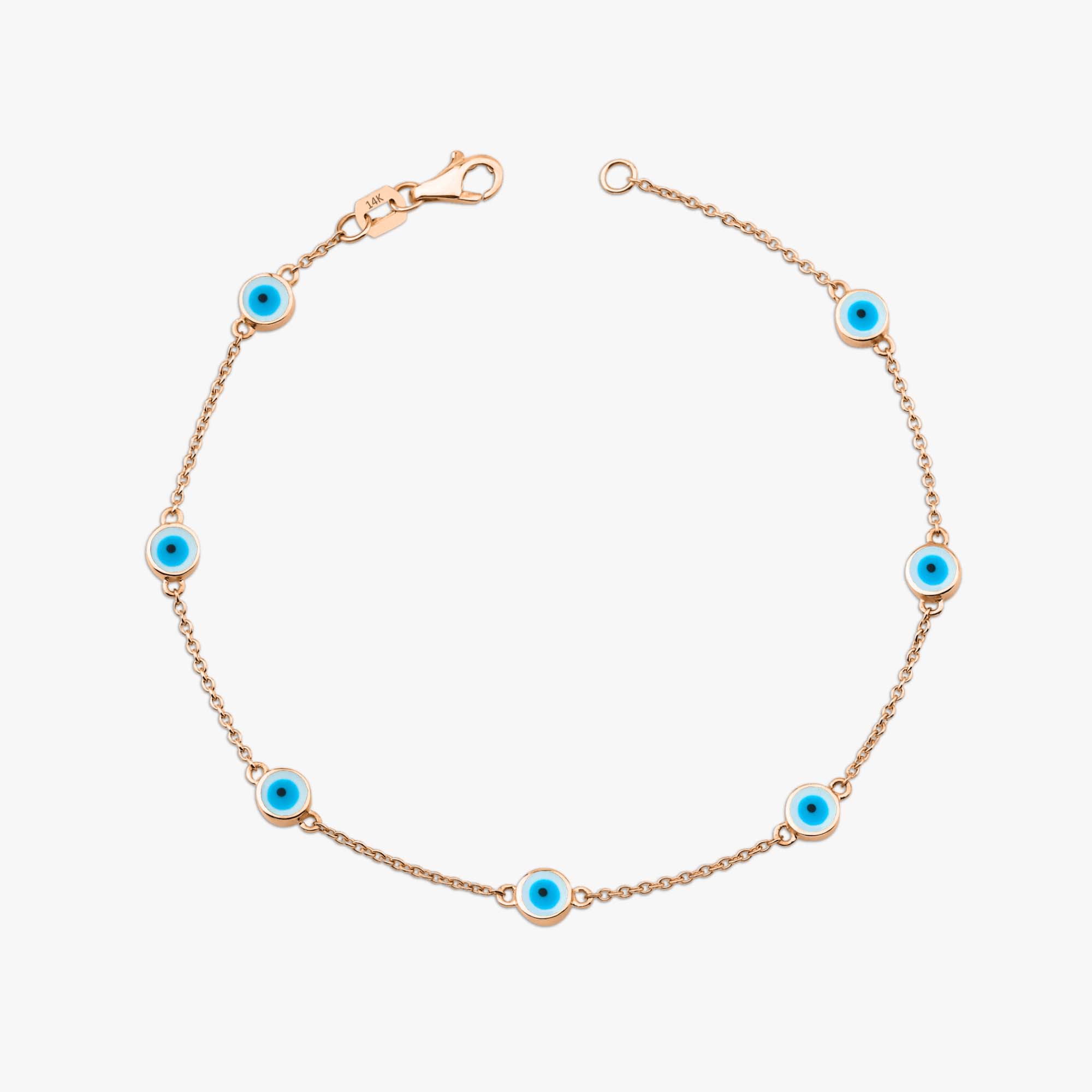 14k rose gold evil eye bracelet with 7 white evil eyes shown on a white background