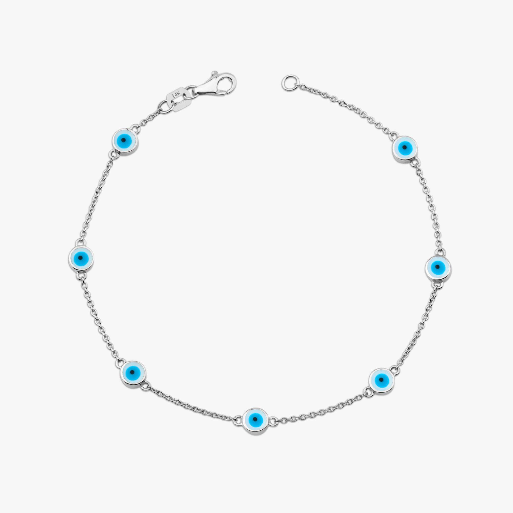 14k white gold evil eye bracelet with 7 white evil eyes shown on a white background