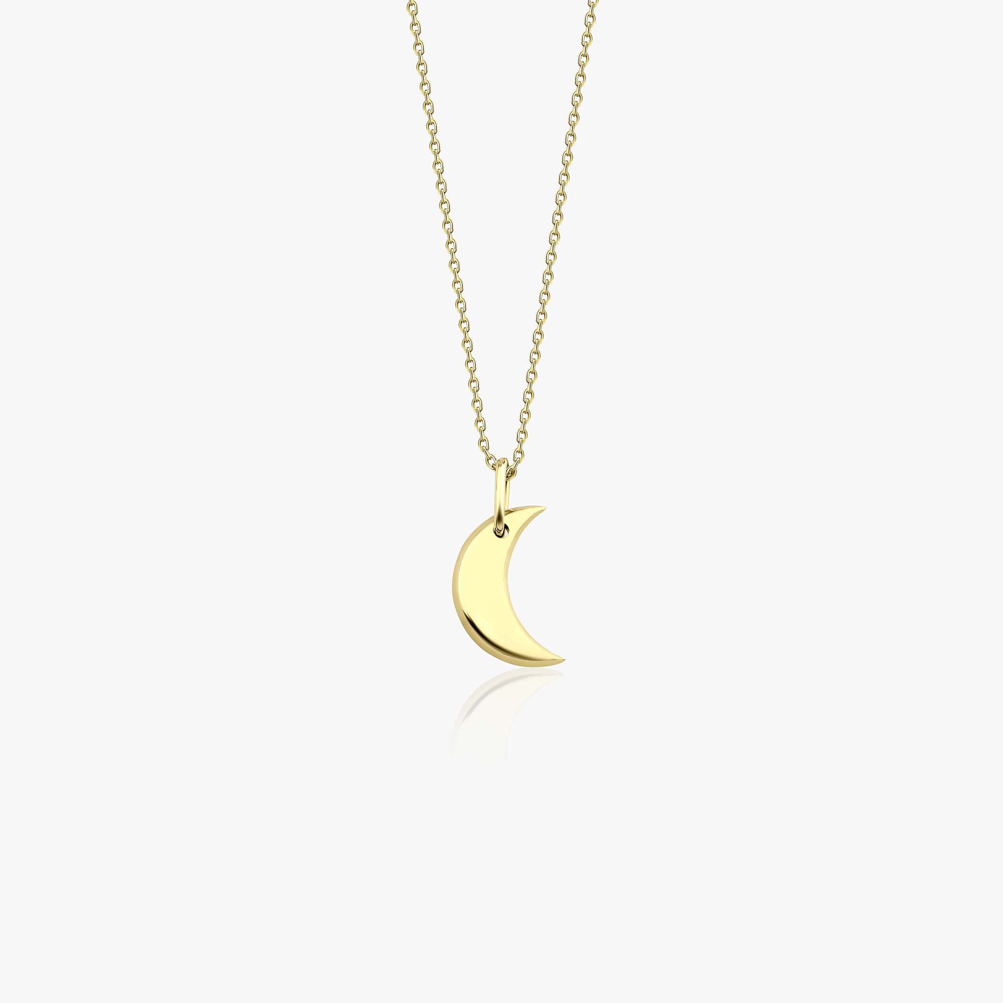 A minimal 14k yellow gold crescent moon necklace on a white background