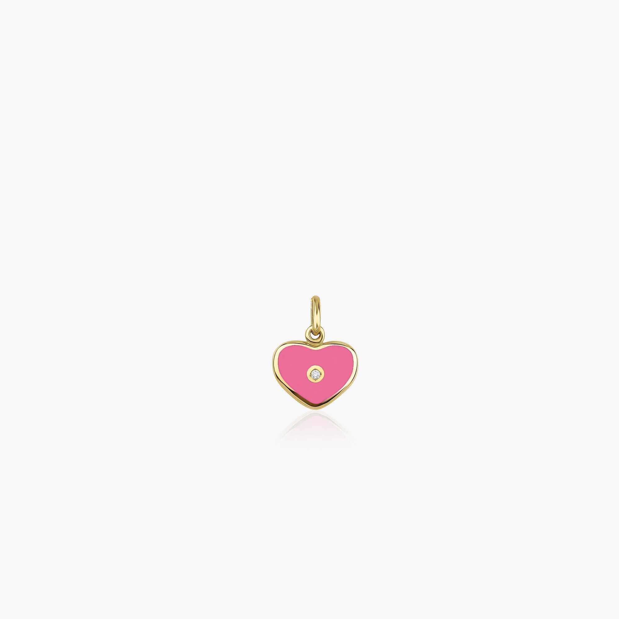 A pink enamel heart pendant with a diamond center shown on a white background