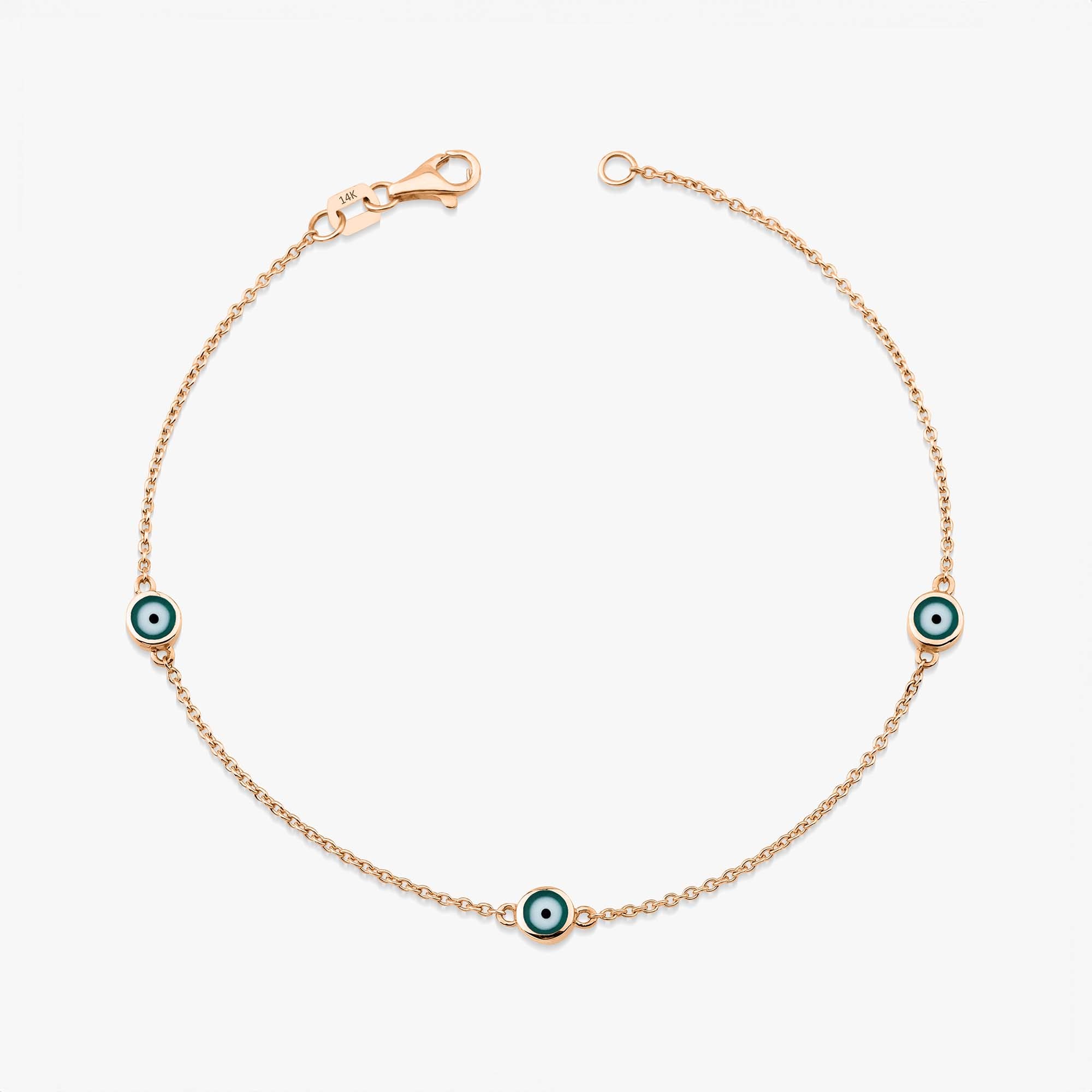 14 karat rose gold three green evil eye bracelet with lobster clasp on a white background