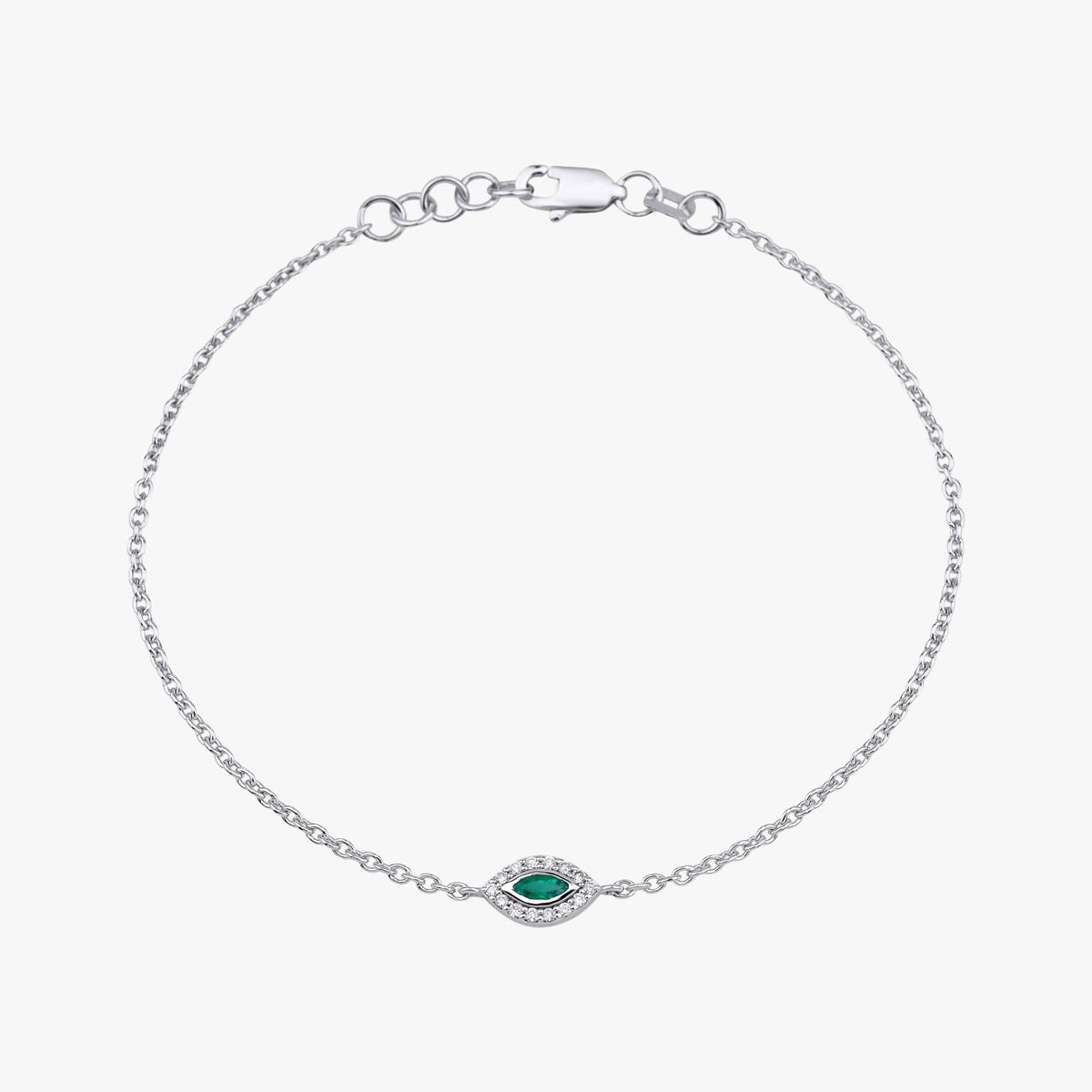 A 14k white gold bracelet with a center marquise cut emerald accompanied by round cut diamonds.