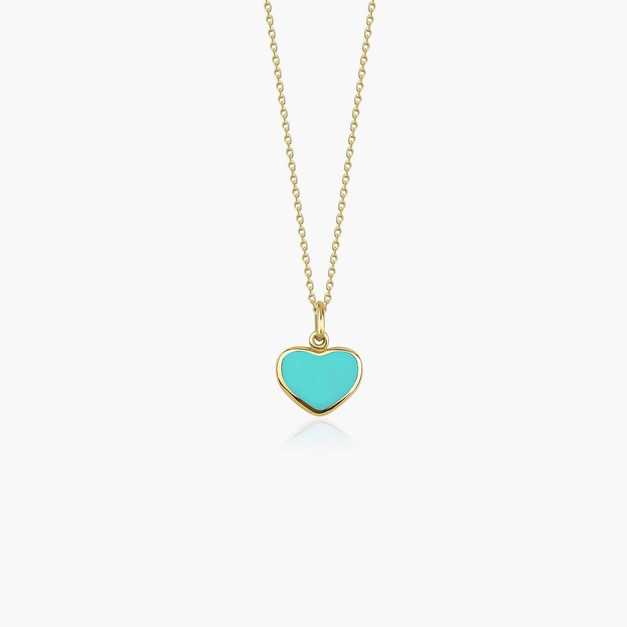 A 14k yellow gold heart pendant necklace with turquoise color enamel center shown on a white background
