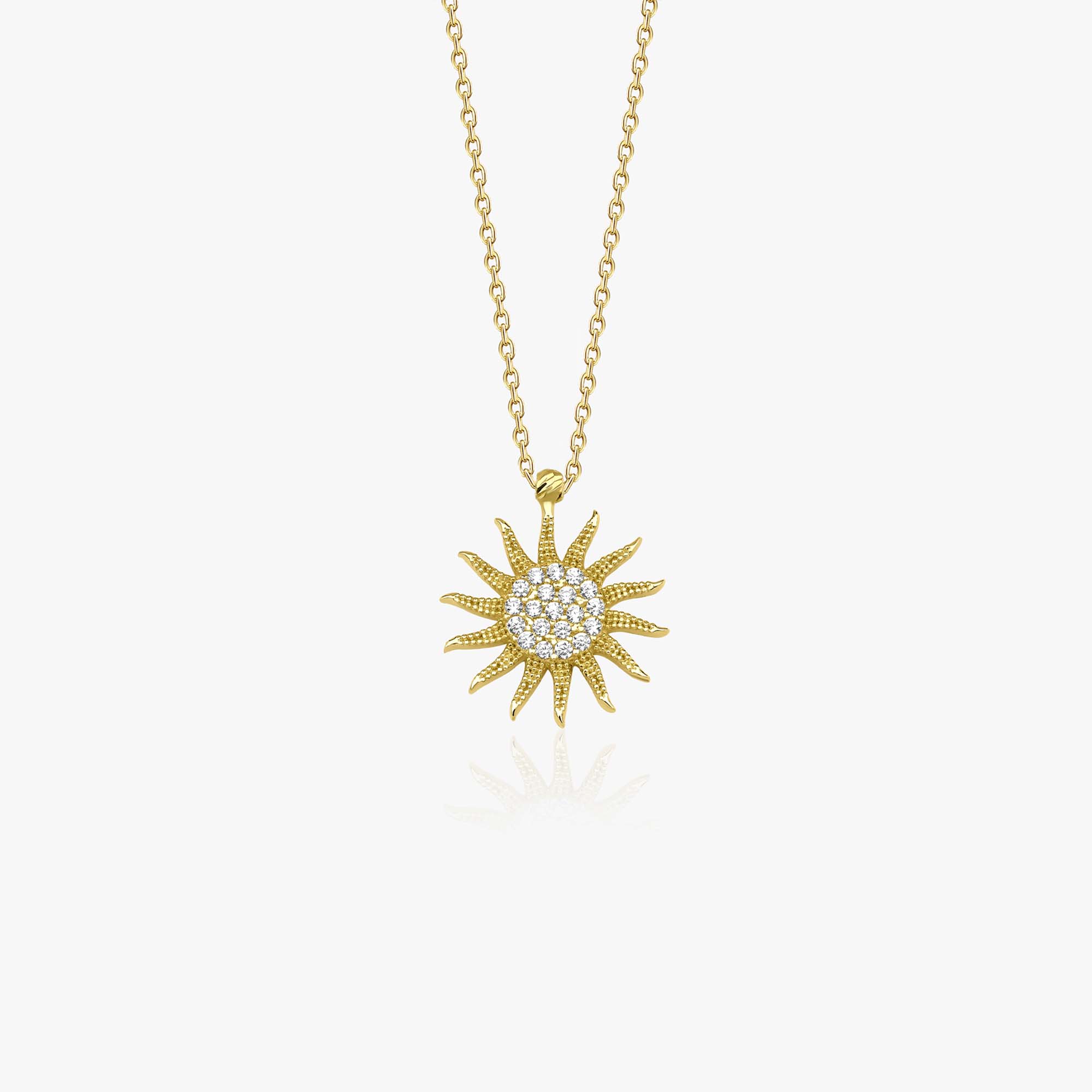 14k yellow gold sun-shaped pendant necklace on a white background