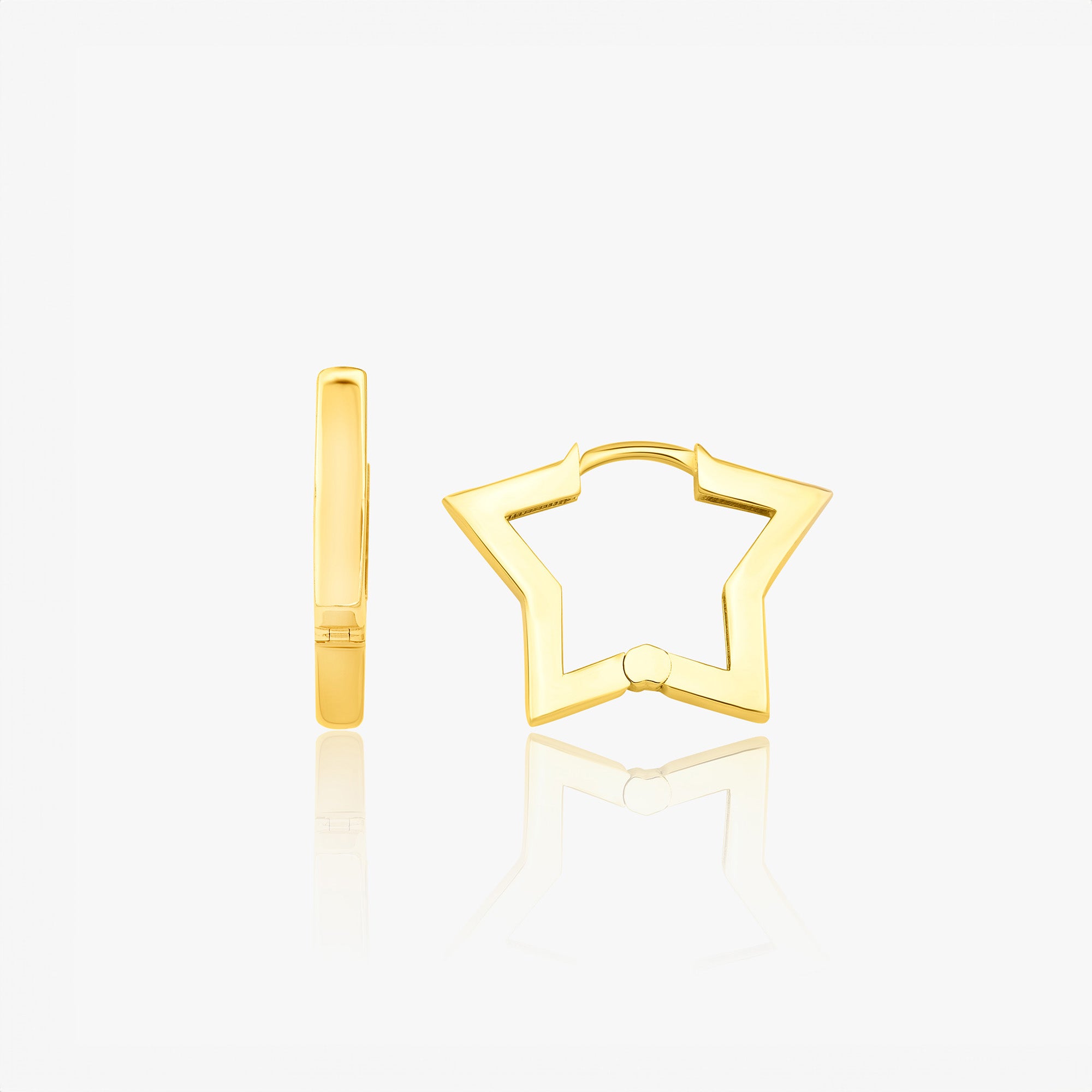 A pair of 14K gold star-shaped huggie hoop earrings on a white background.