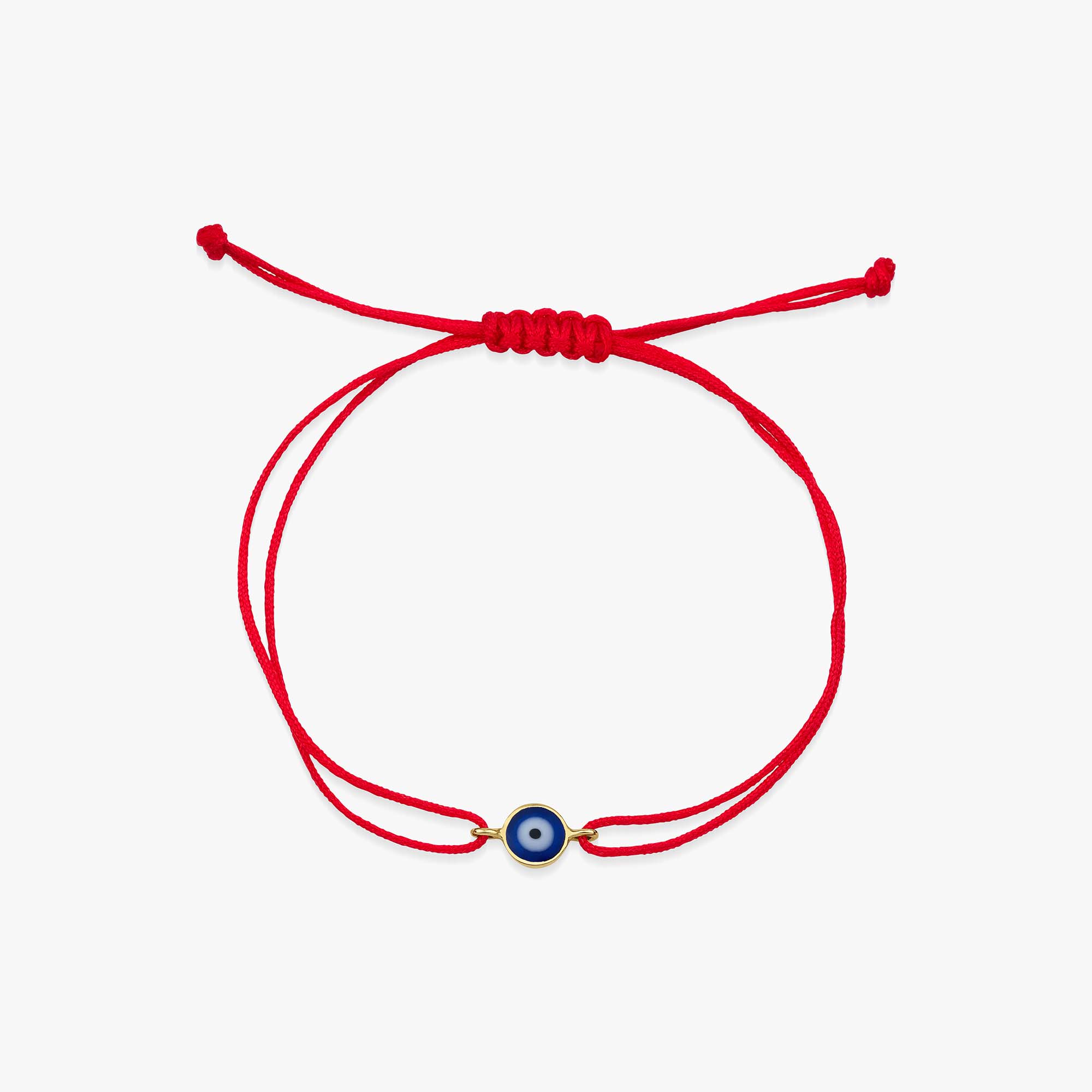 Red bracelet with a blue evil eye charm on a white background