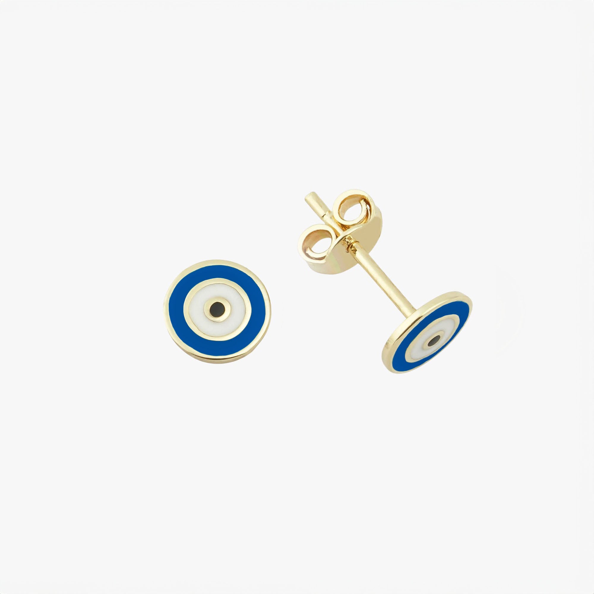 Sideview of a navy blue evil eye stud in a white background