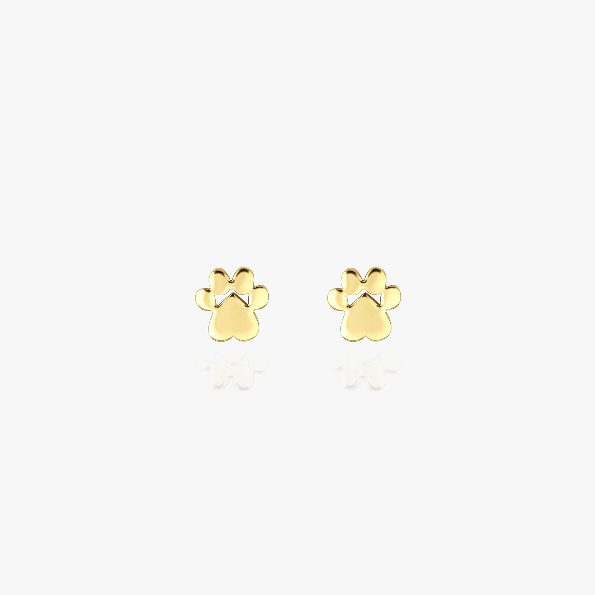 Minimal 14k yellow gold paw studs on a white background.