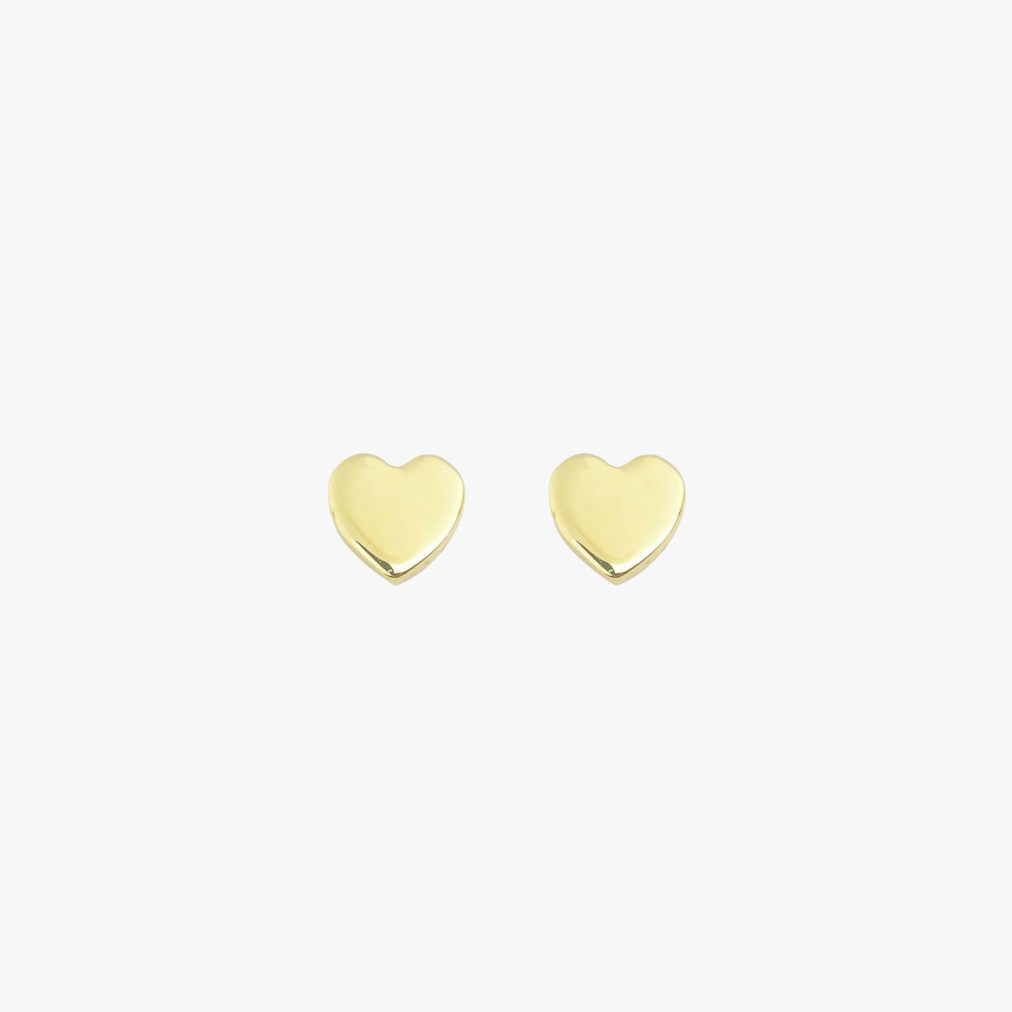 A pair of 14k yellow gold heart studs shown on a white background