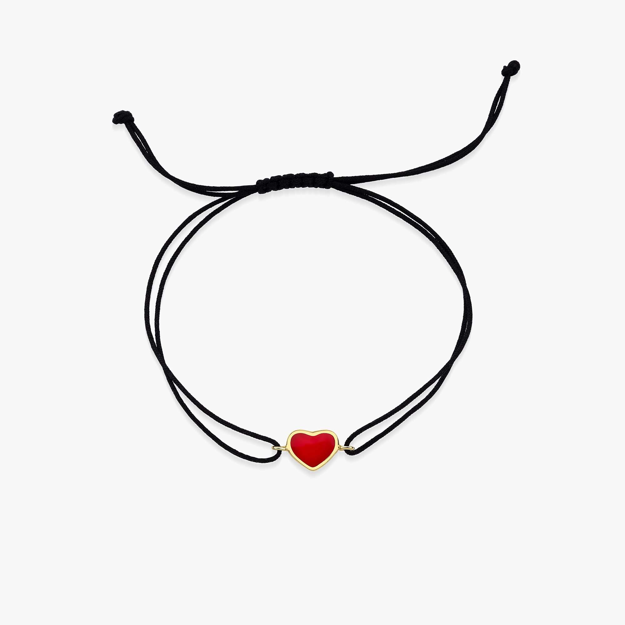 Bracelet with a red heart charm on a white background