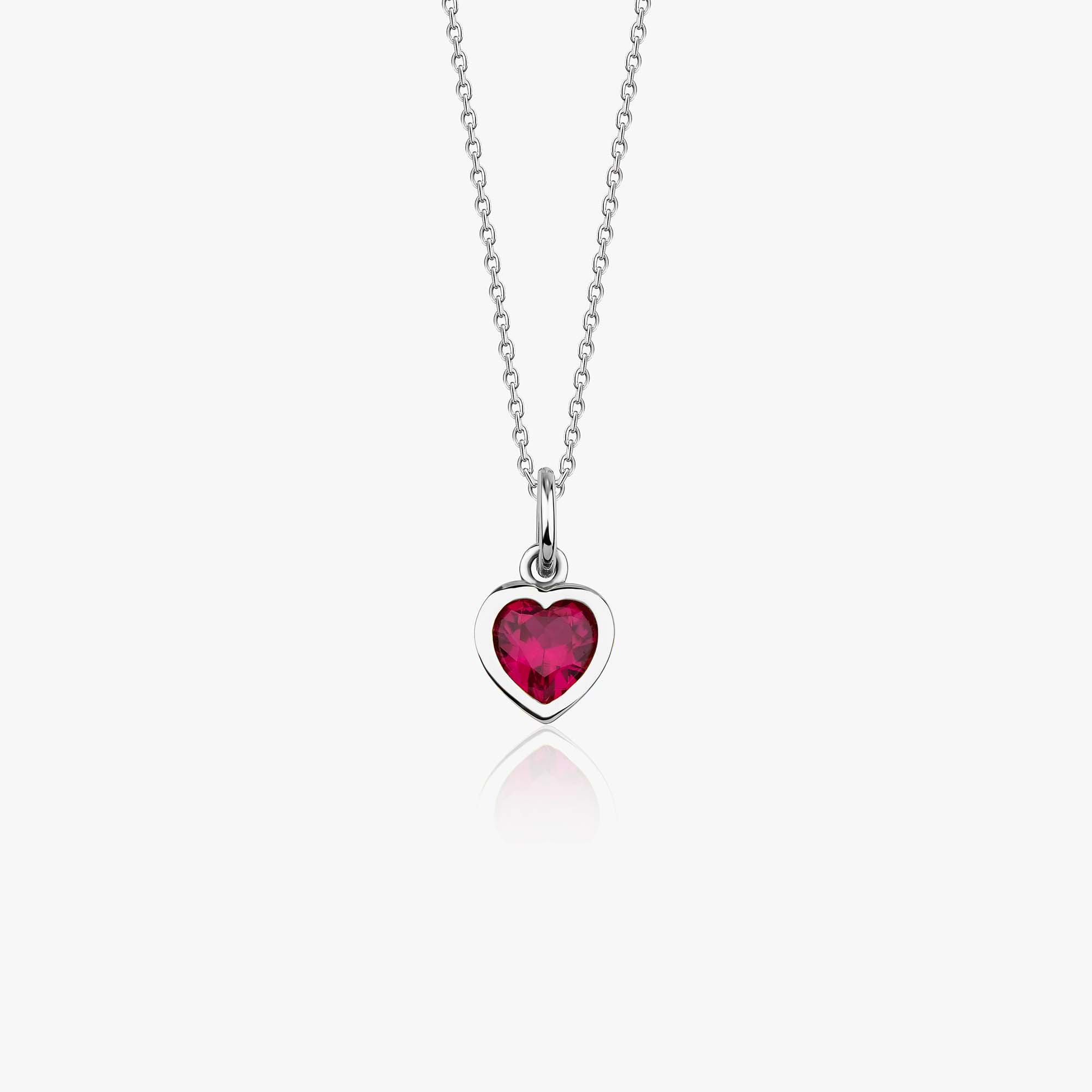 A 14k white gold necklace with a heart-shaped red gemstone pendant on a white background