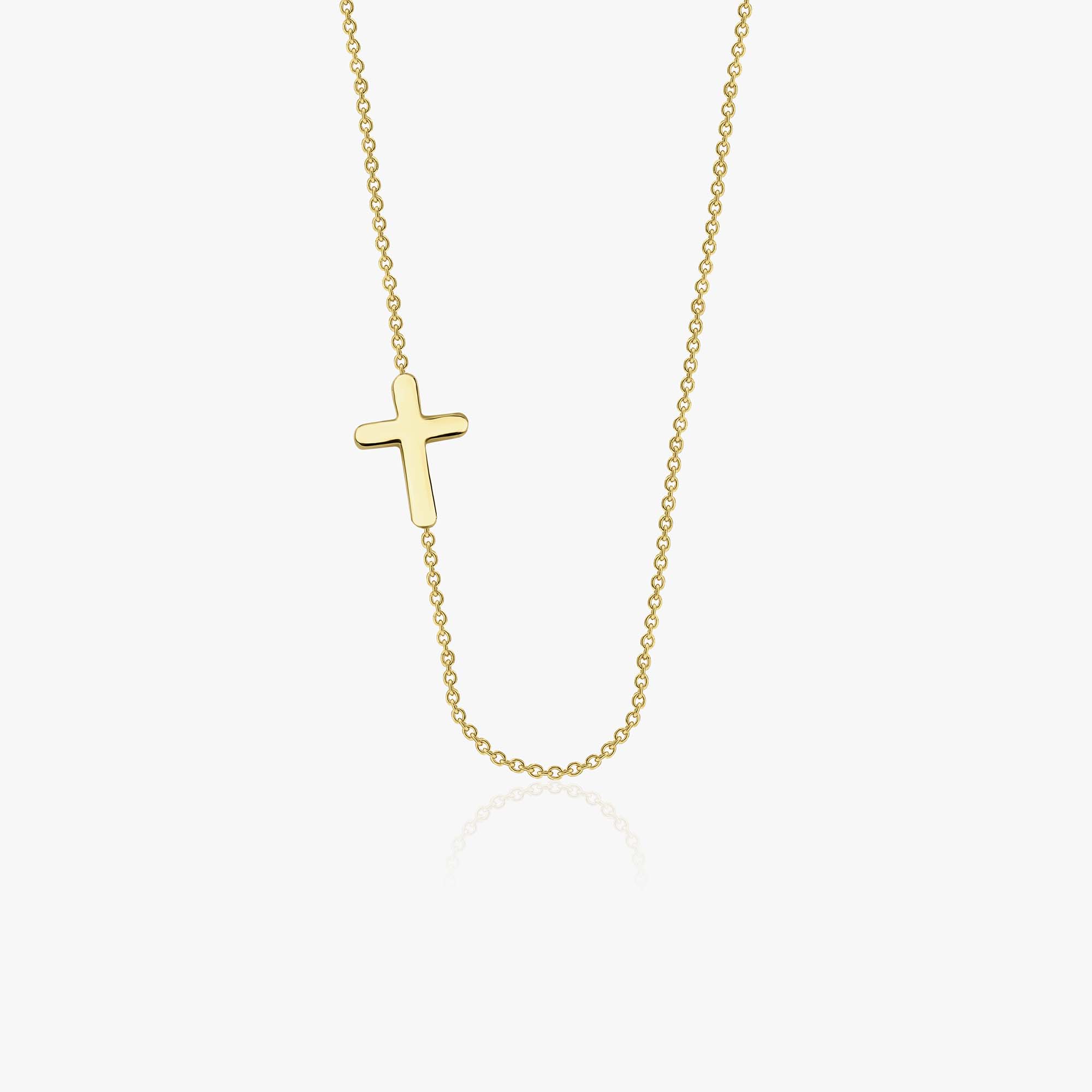 A 14k yellow gold sideways cross necklace show in white background