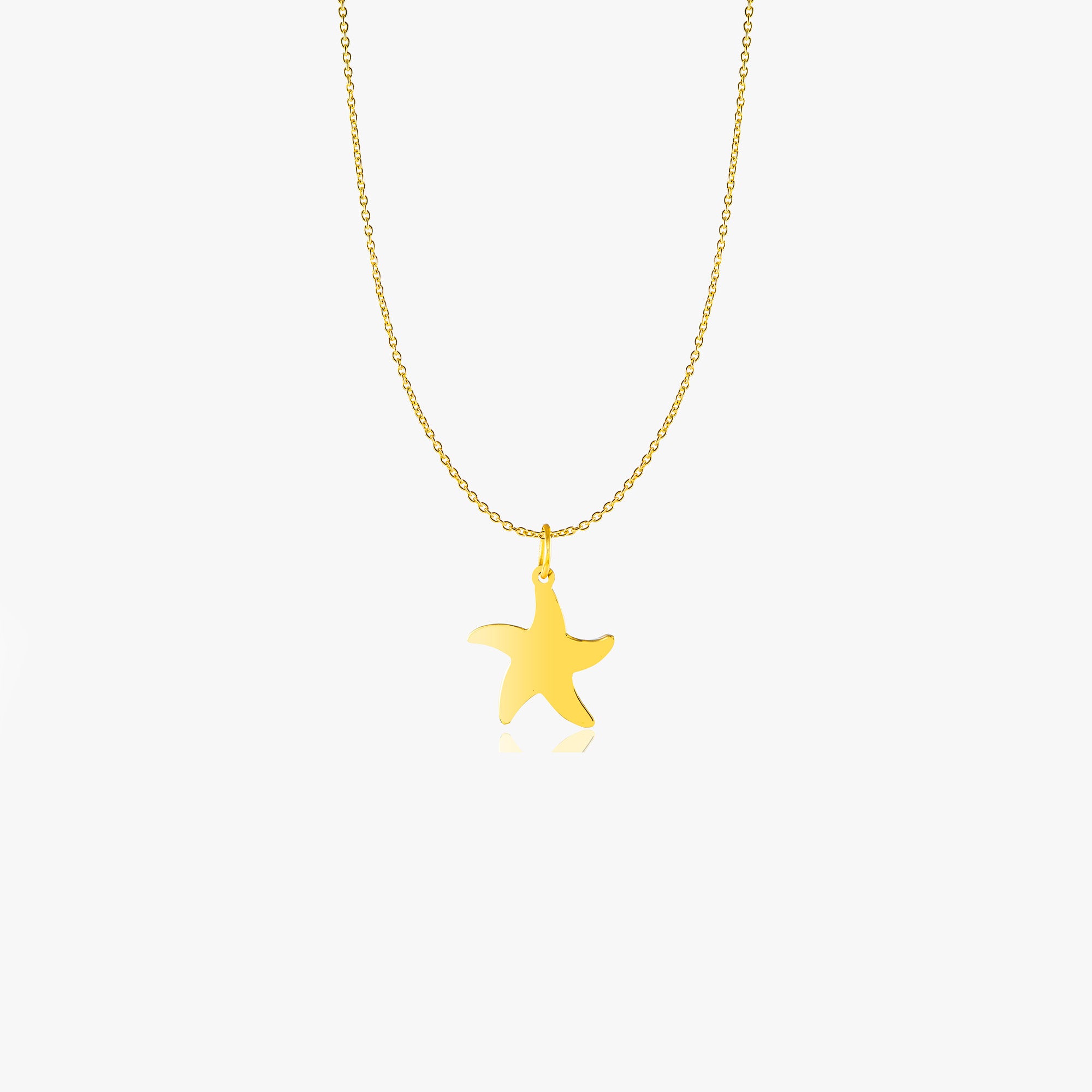 A 14K gold necklace with a dainty starfish pendant.