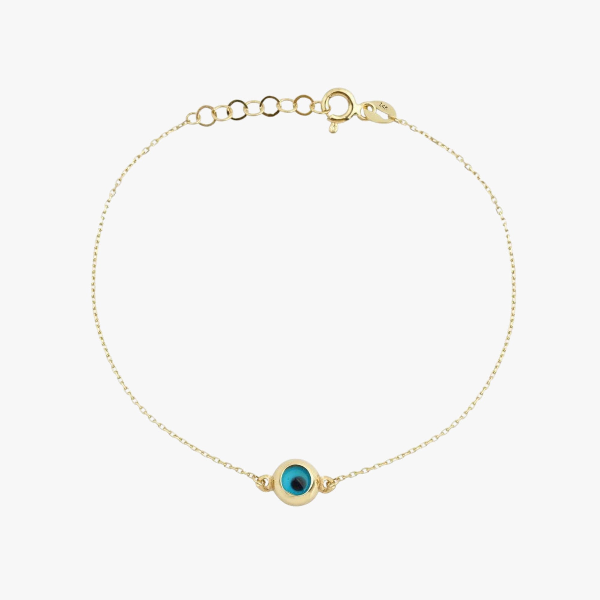 A 14K gold bracelet with an evil eye design featuring a blue centerpiece.