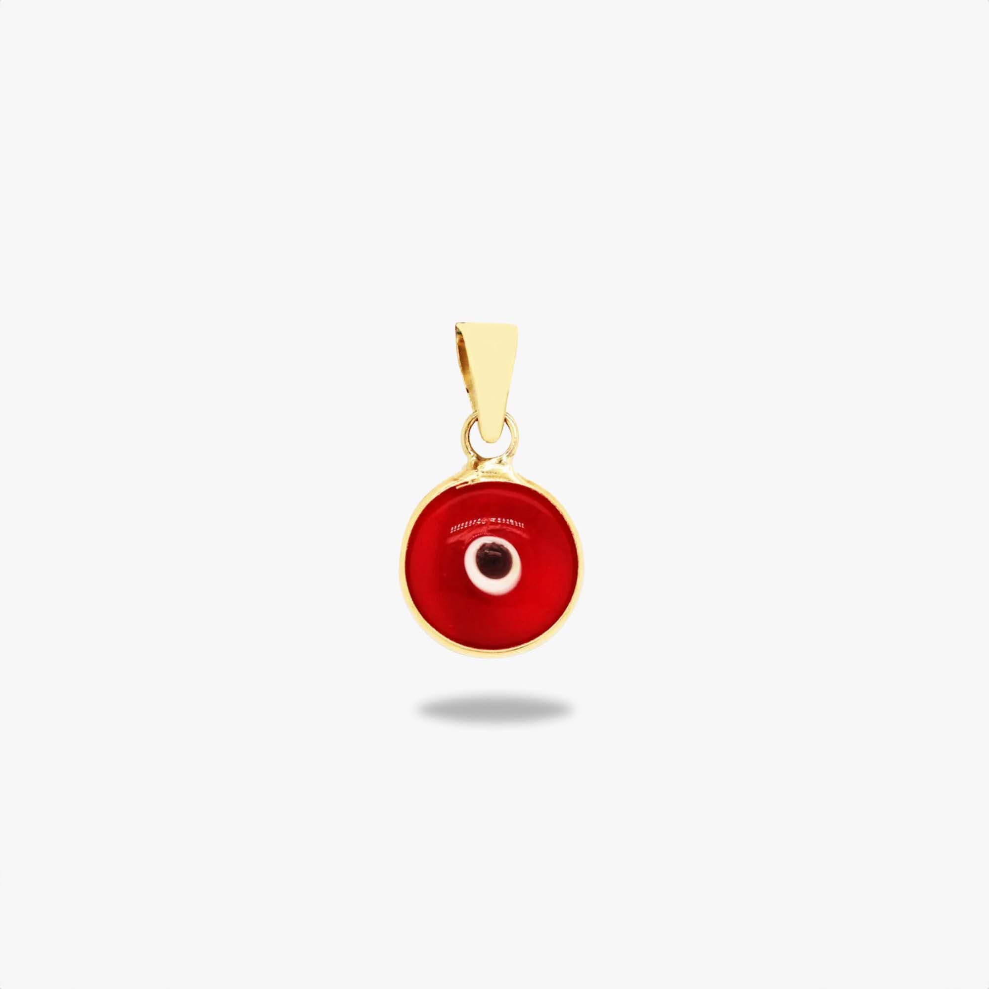 A 14k yellow gold translucent red evil eye pendant shown on a white background.