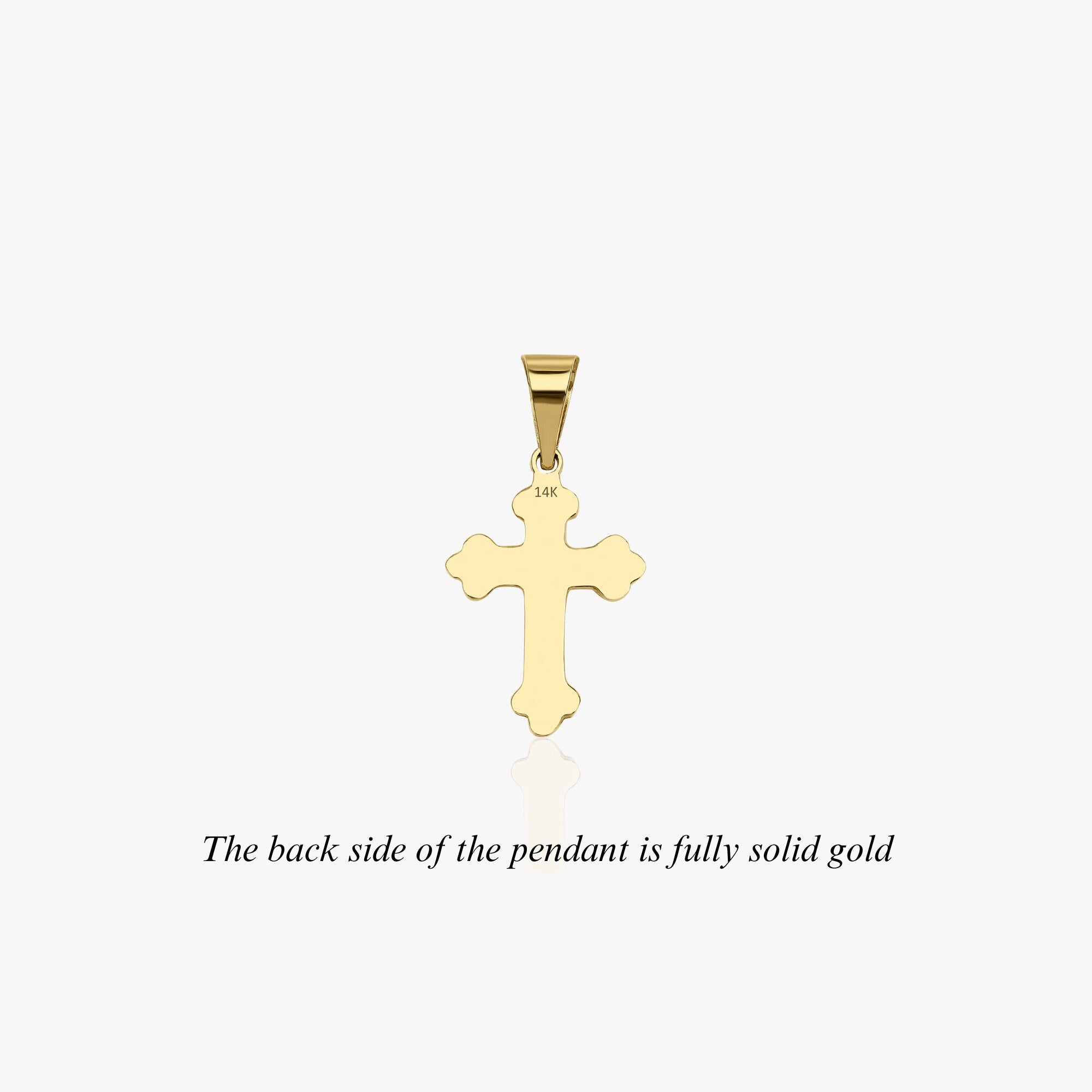 The backside of the small cross pendant shown on a white background