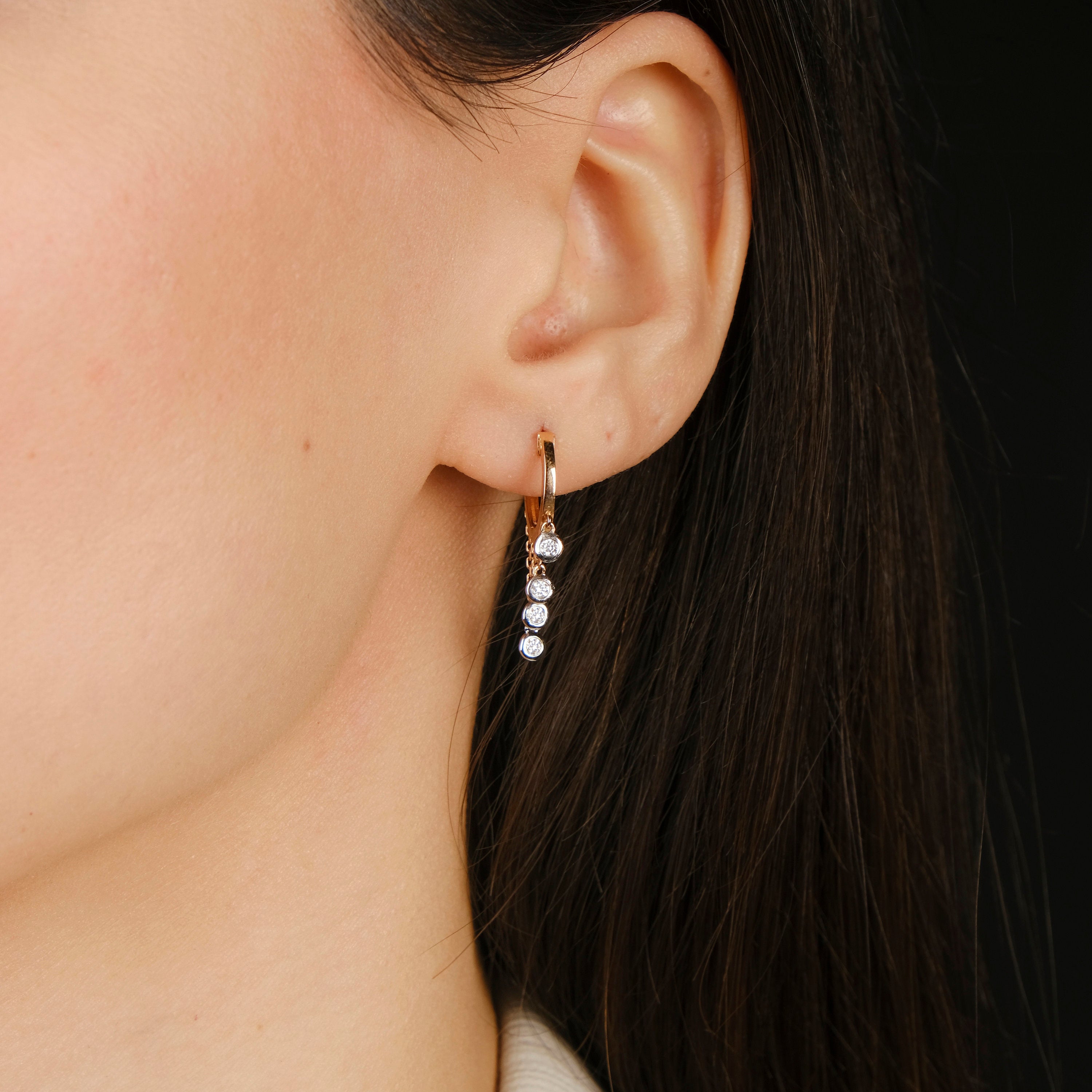 Diamond Huggie Hoops With Bezel Set Diamond Dangling Charms in 14K Gold