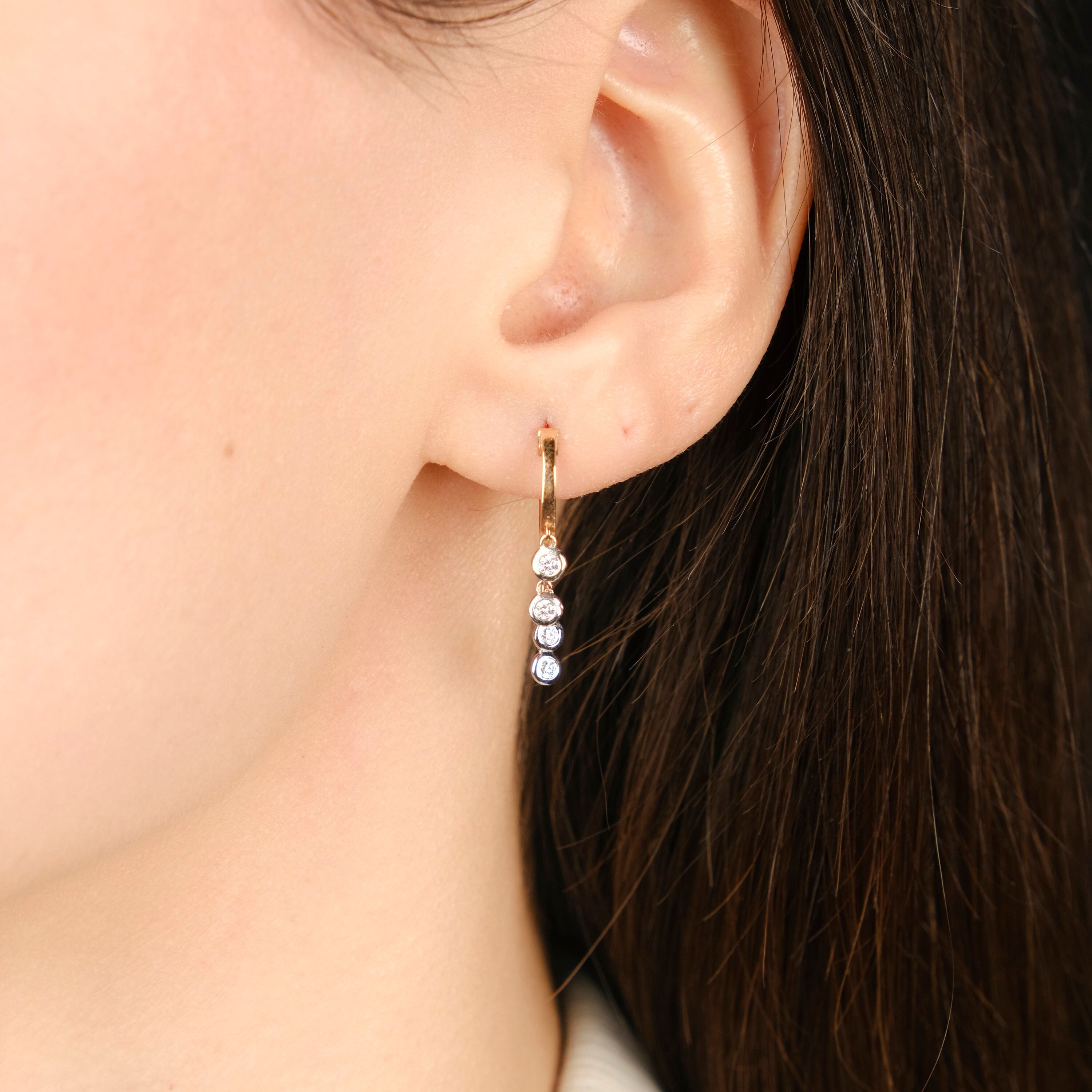 Diamond Huggie Hoops With Bezel Set Diamond Dangling Charms in 14K Gold