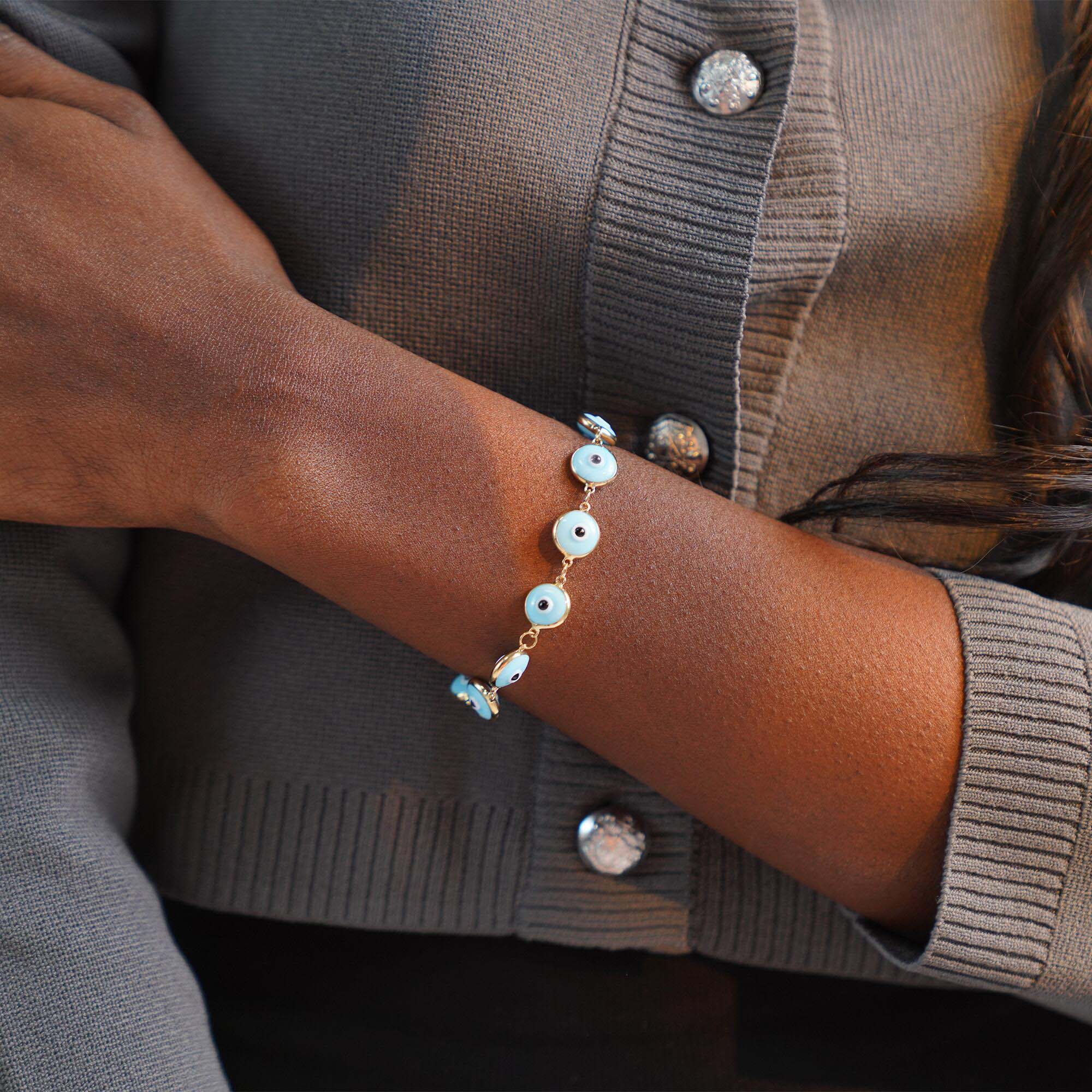 Model wearing a baby blue evil eye bracelet