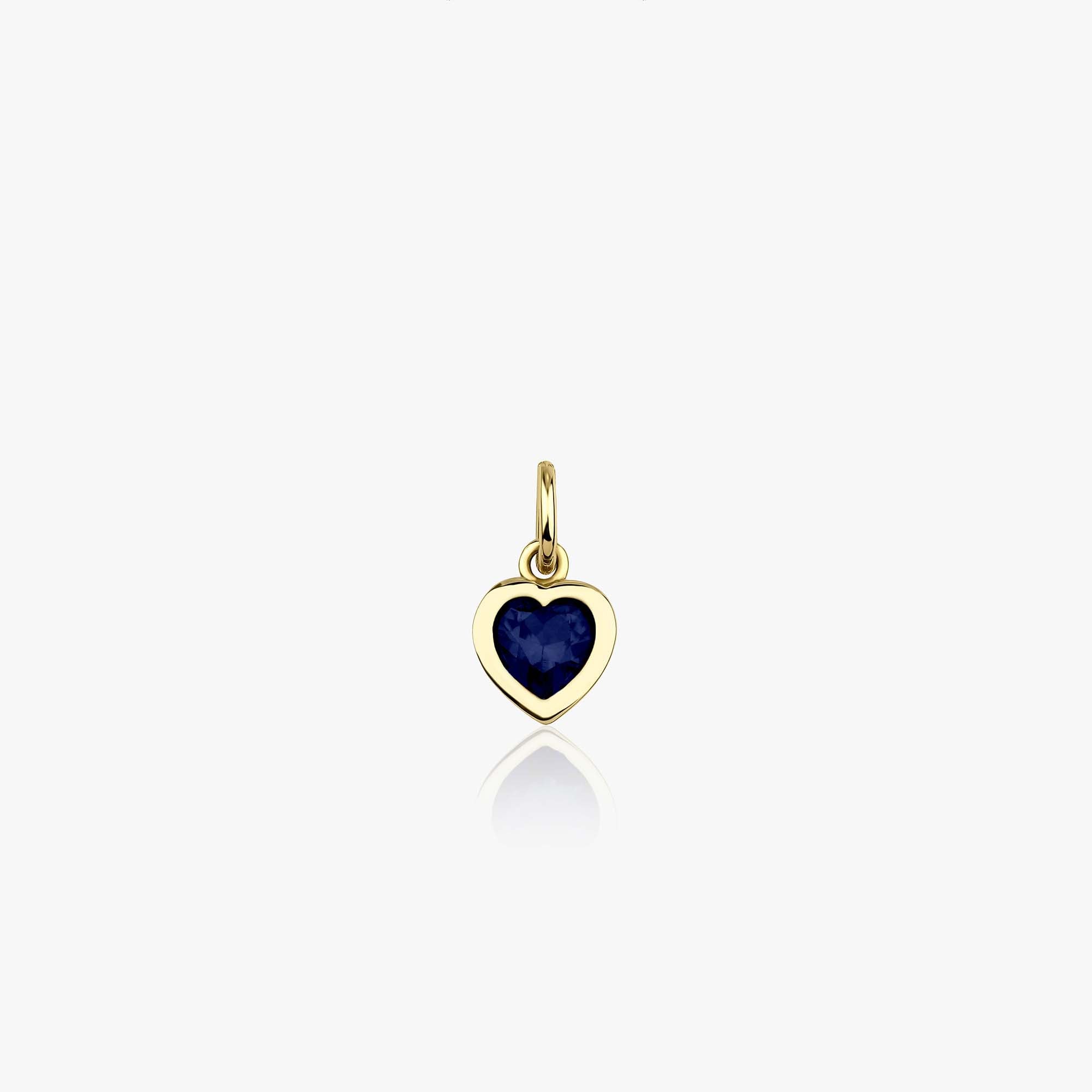 A 14k yellow gold heart-shaped pendant with a blue stone on a white background