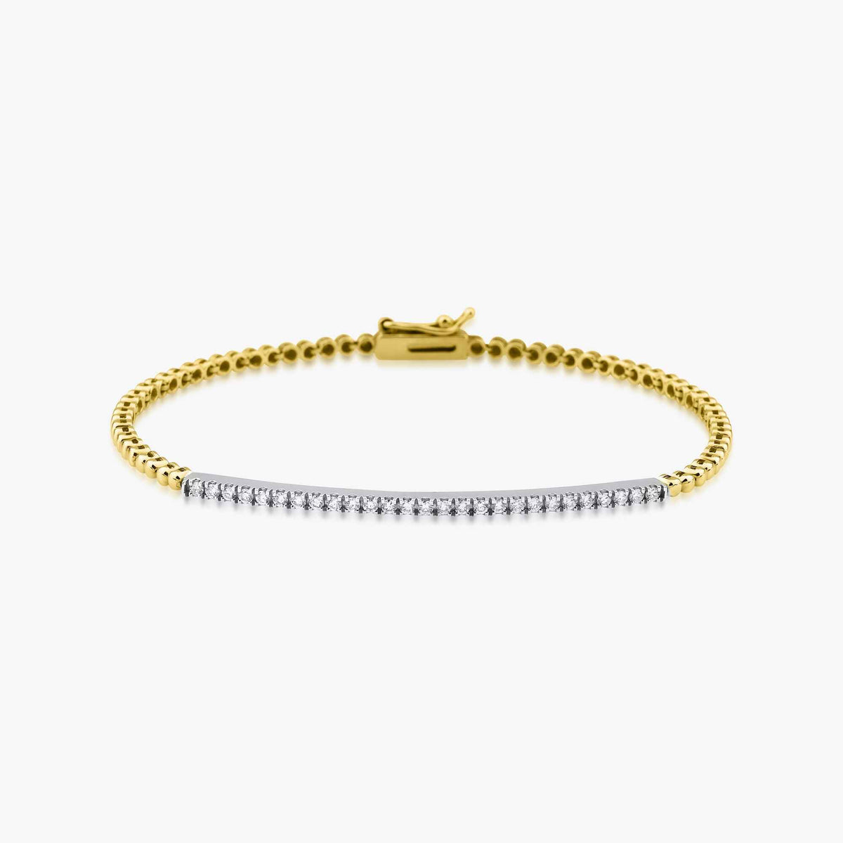 A 14K gold diamond line bracelet with a solid gold chain and a series of round diamonds on the chain.