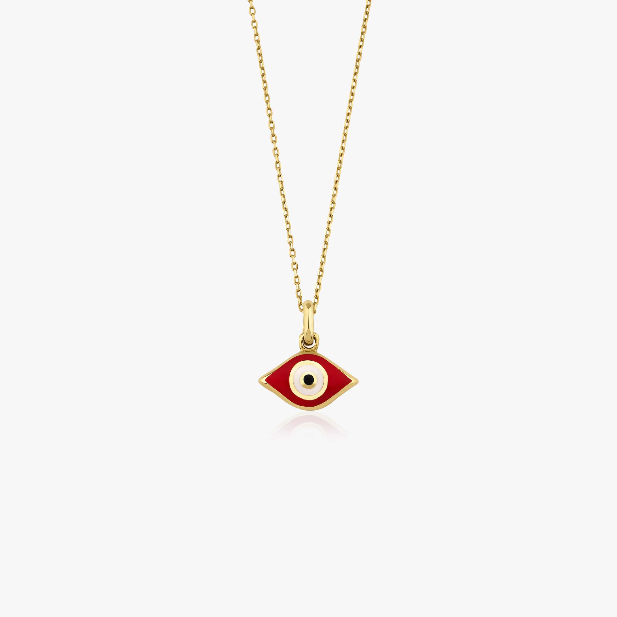 An elongated red and gold-colored Greek eye necklace on a white background