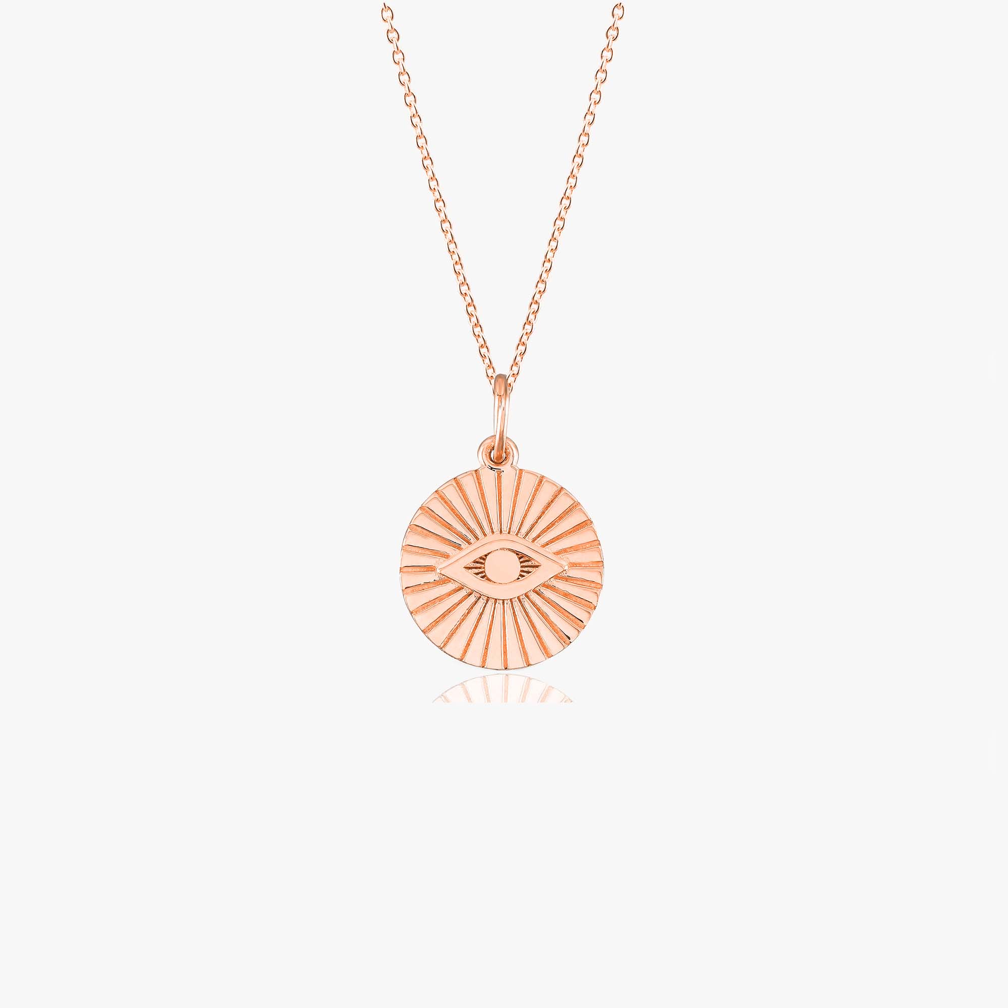 A 14k rose gold evil eye coin pendant necklace shown on a white background