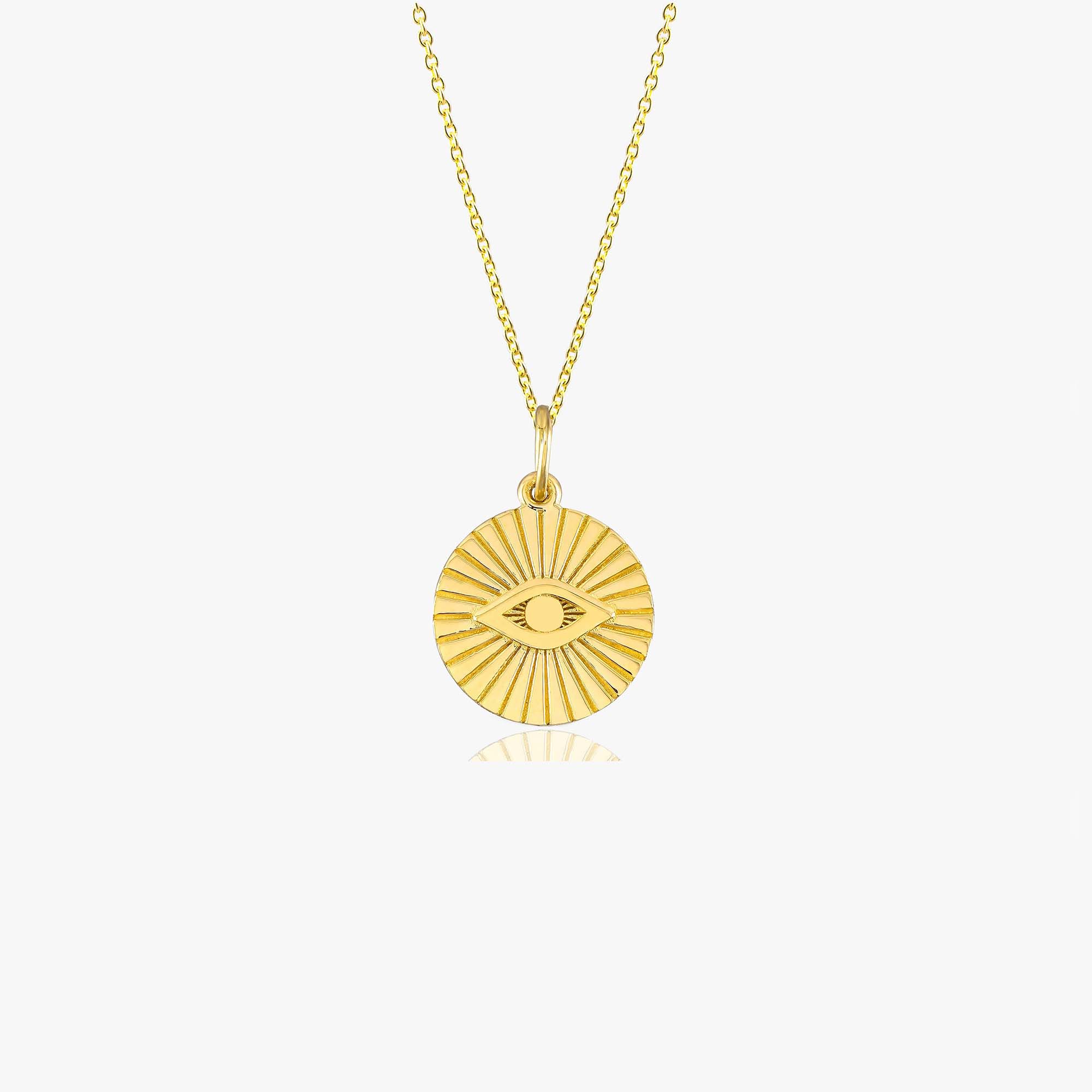 A 14k yellow gold evil eye coin pendant necklace shown on a white background