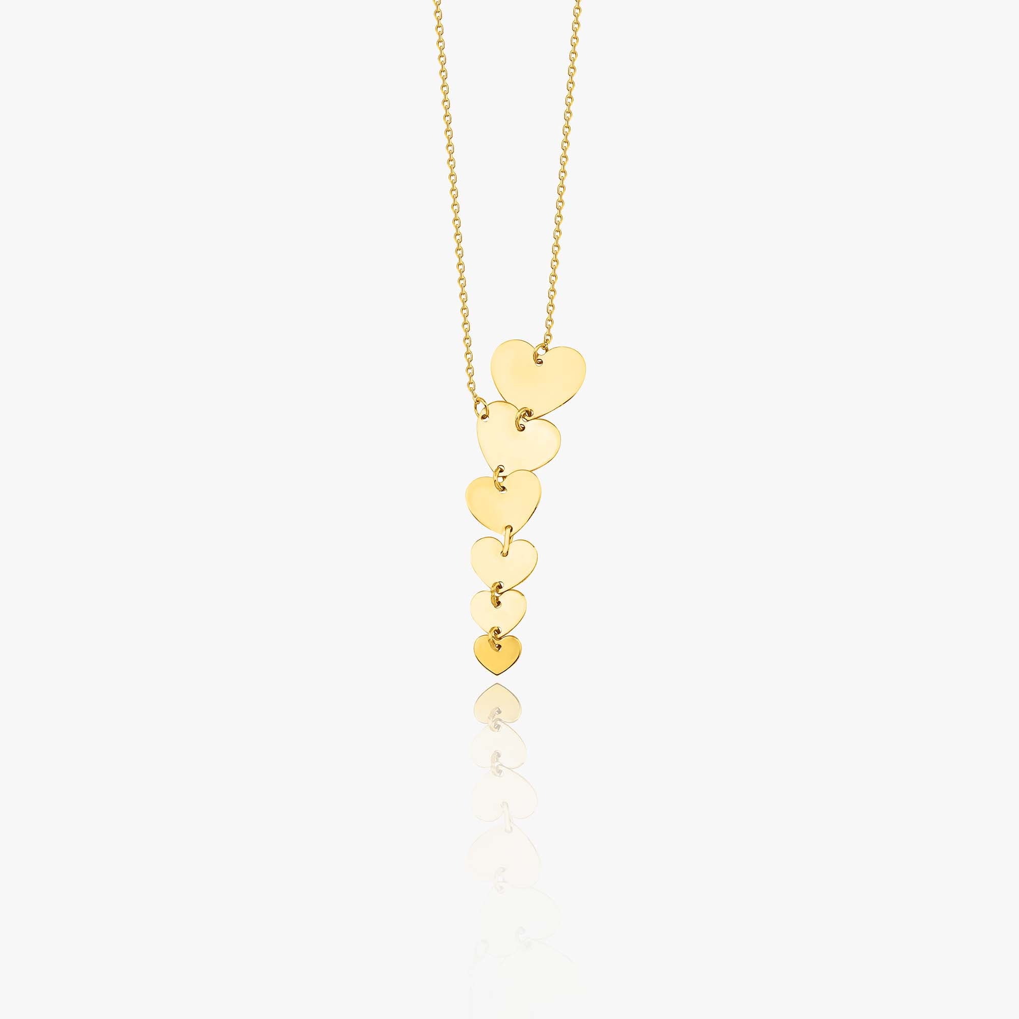A graduated heart lariat necklace shown on a white background.
