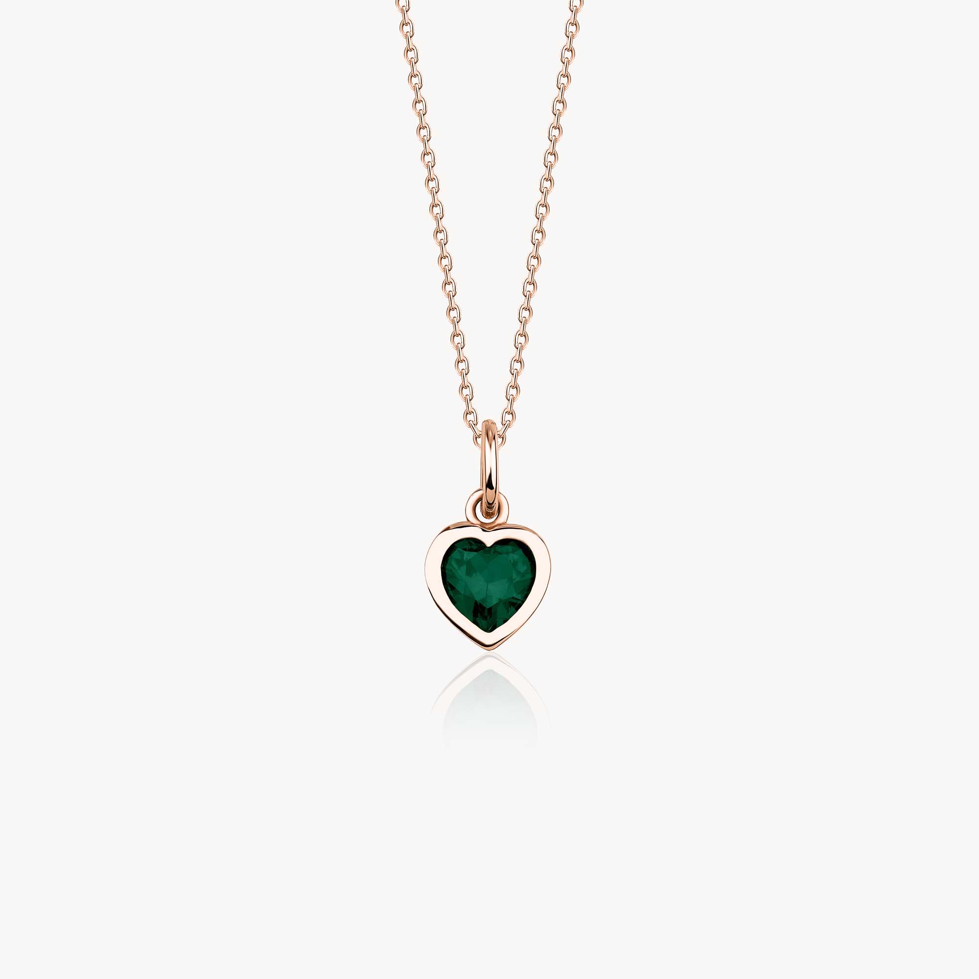 A 14k rose gold heart necklace with a green heart cut cubic zirconia center shown on a white background.