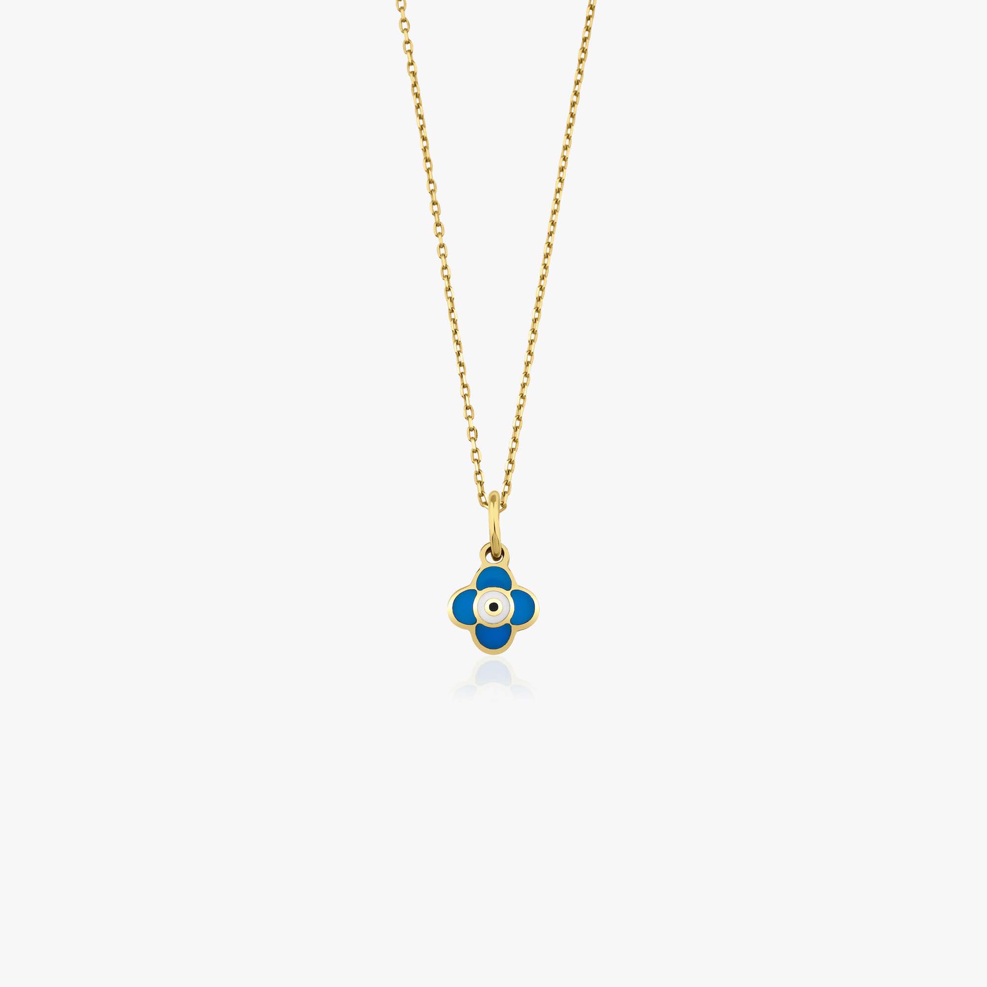 A 14k yellow gold necklace with a tiny clover pendant shown on a white background
