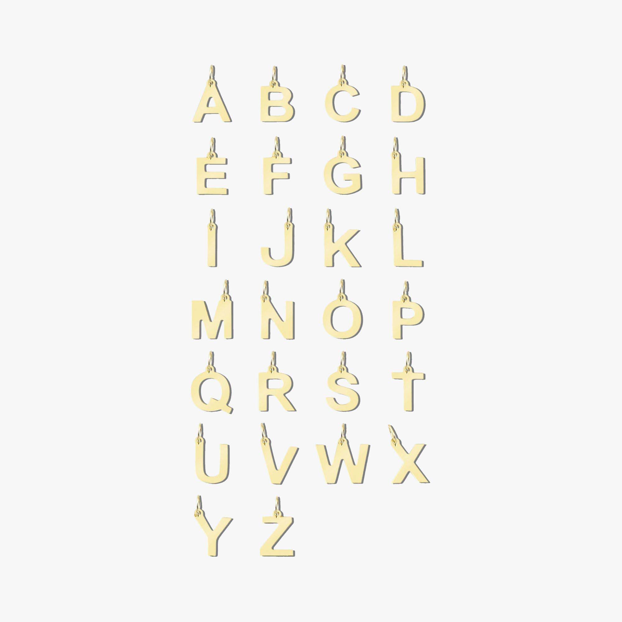 A collection of 14k gold initial charms designed in the shape of the alphabet from A to Z.