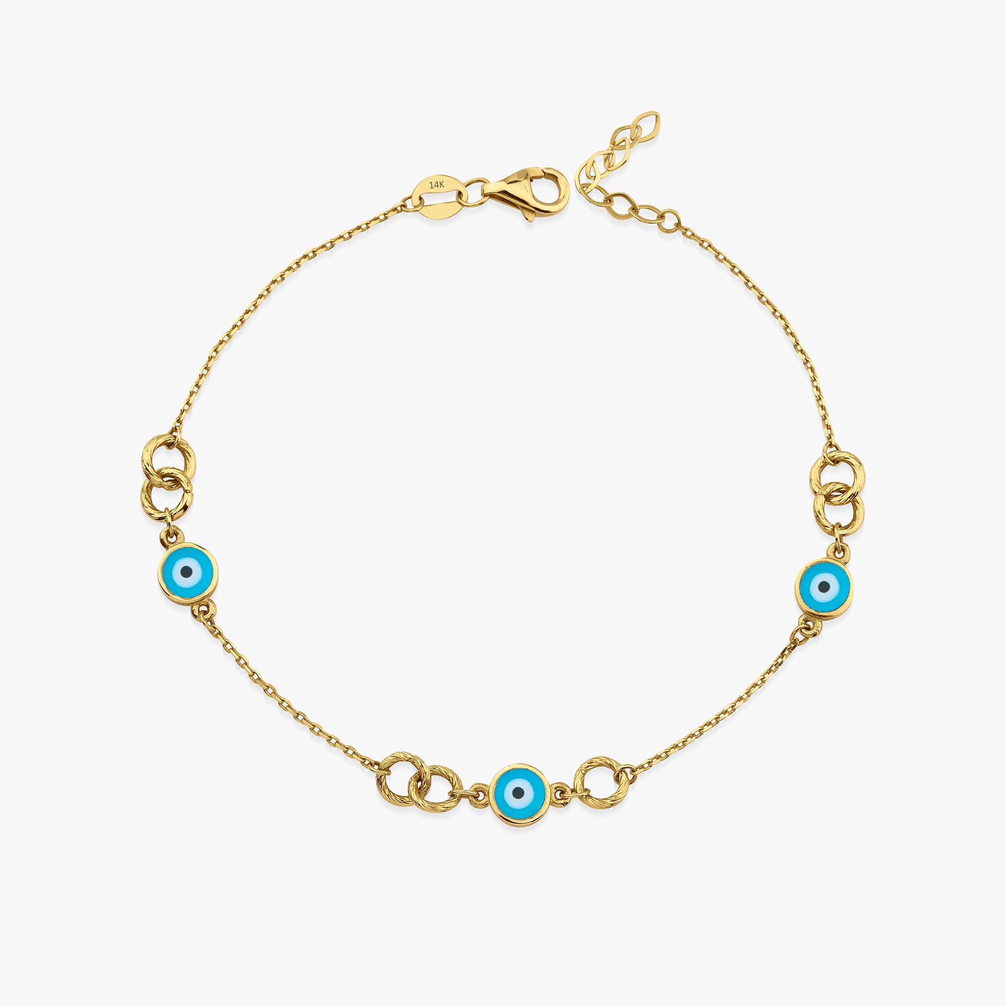 Gold bracelet with blue evil eye charms on a white background