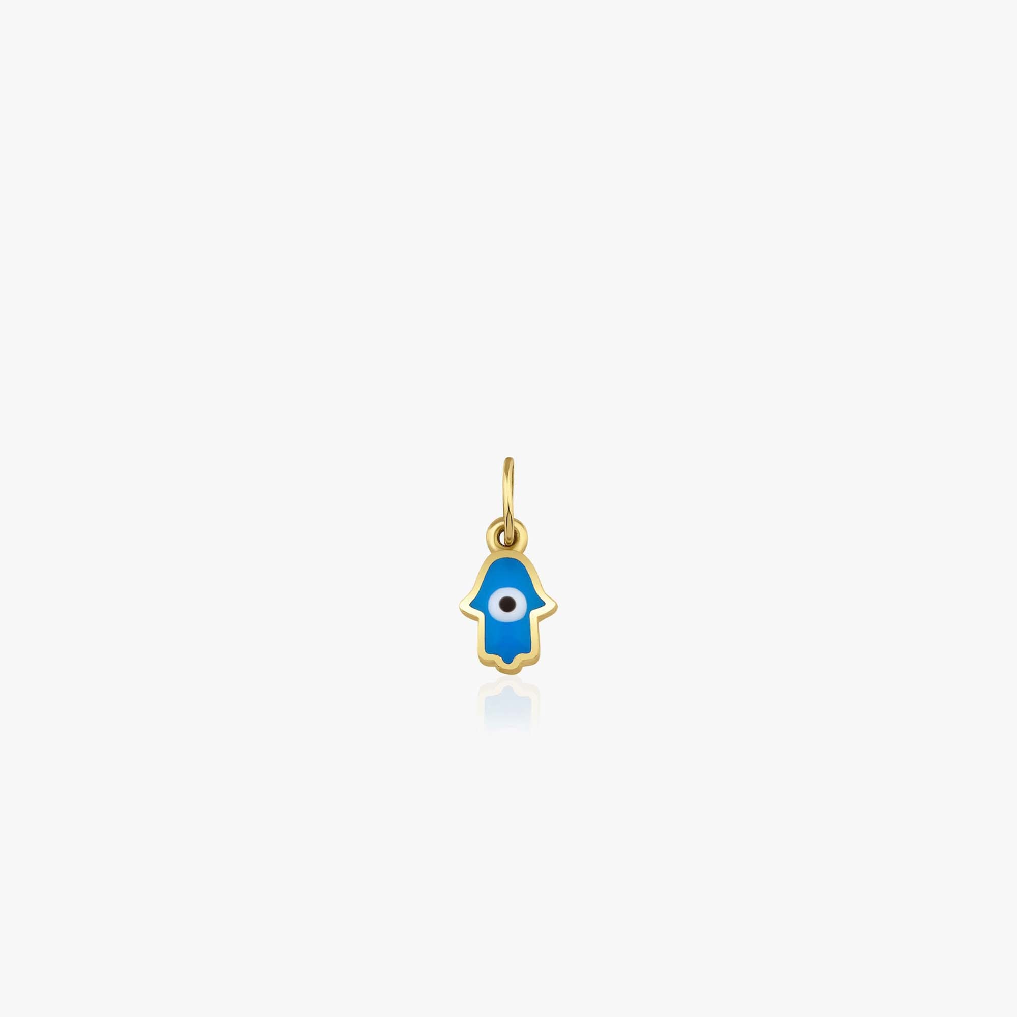 A 14k yellow gold tiny hamsa hand pendant with an evil eye center shown on a white background.