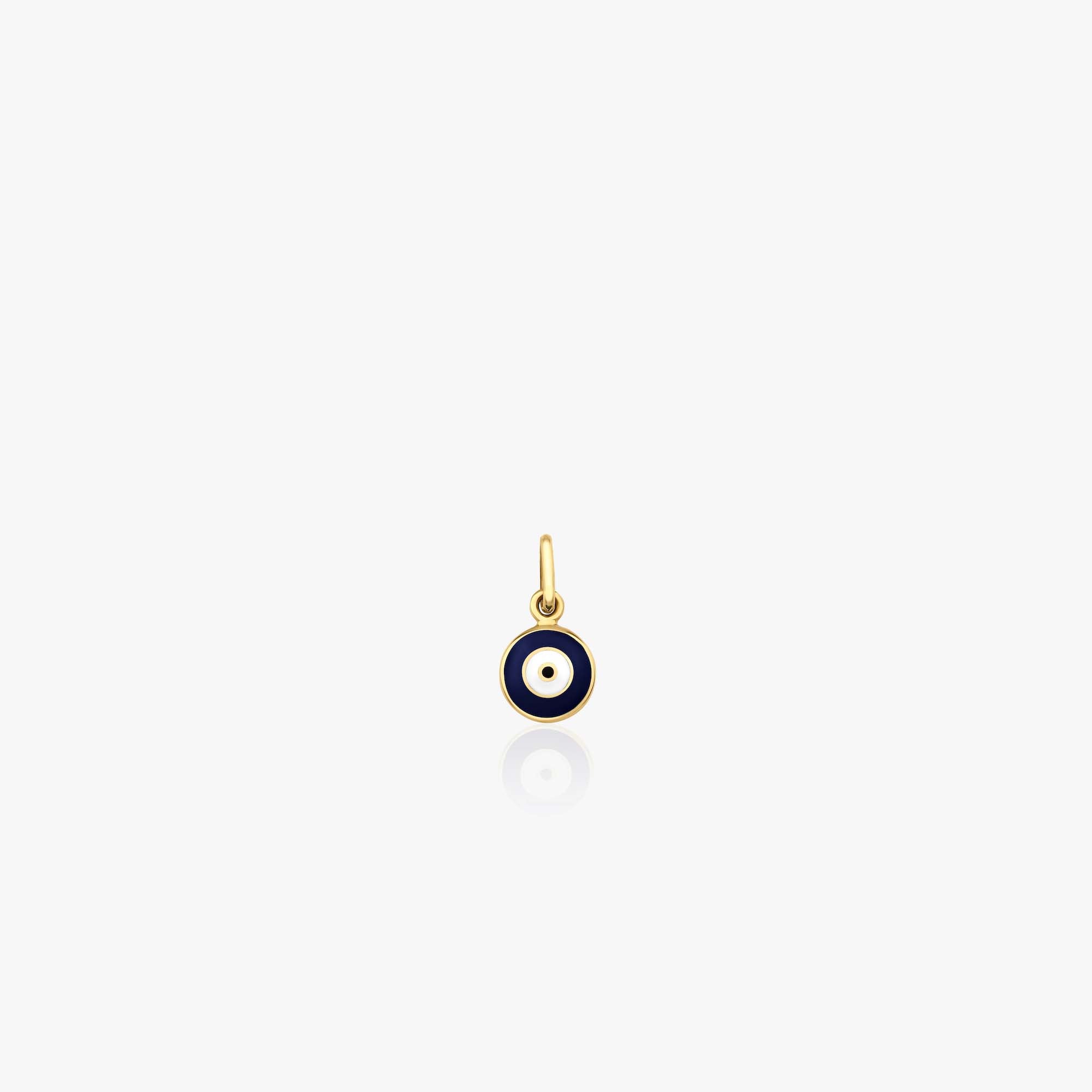 A 14k yellow gold itty bitty tiny navy blue evil eye pendant shown on a white background.