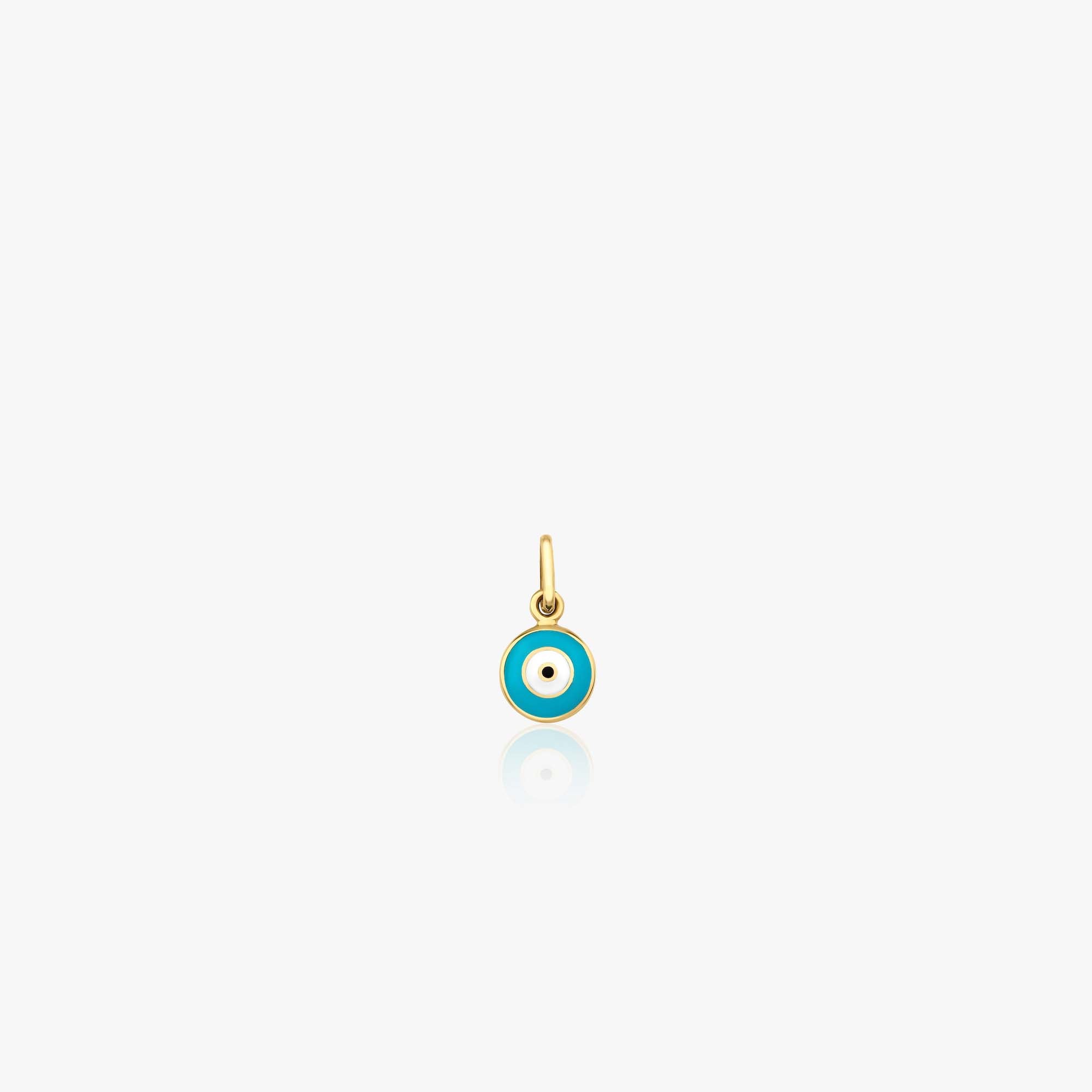 A tiny 14k yellow gold turquoise evil eye pendant shown on a white background.
