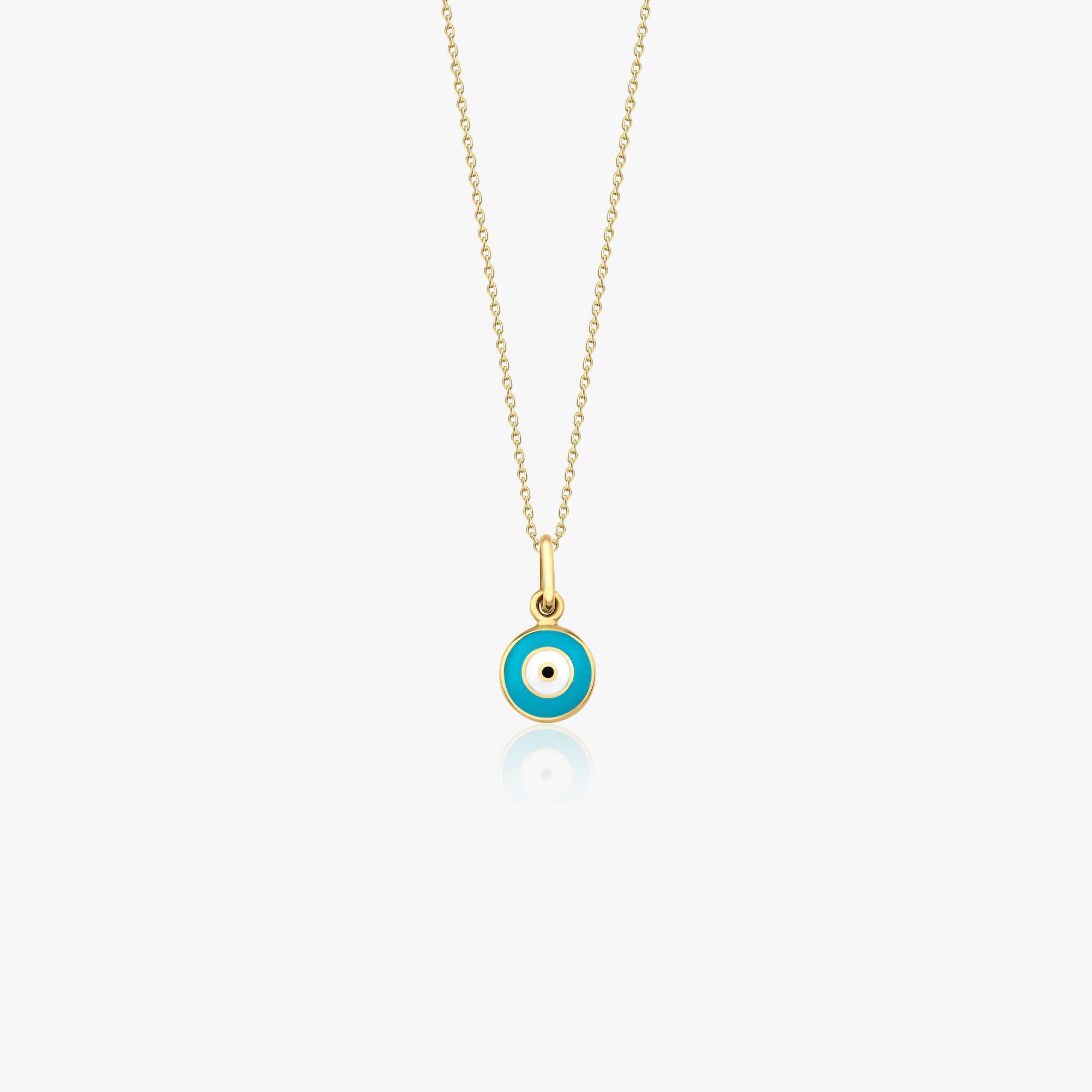 A 14k yellow gold tiny evil eye pendant necklace shown on a white background.