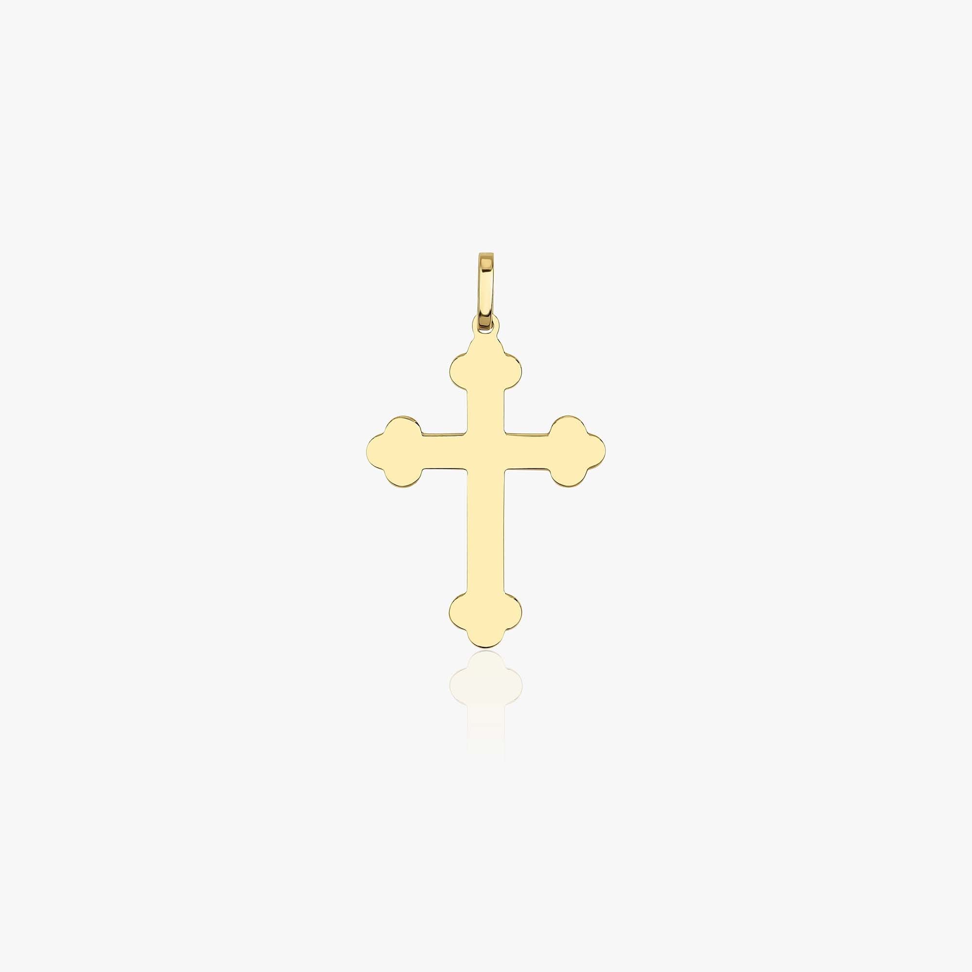 A large solid gold cross pendant with a yellow gold finish, displayed against a white background.
